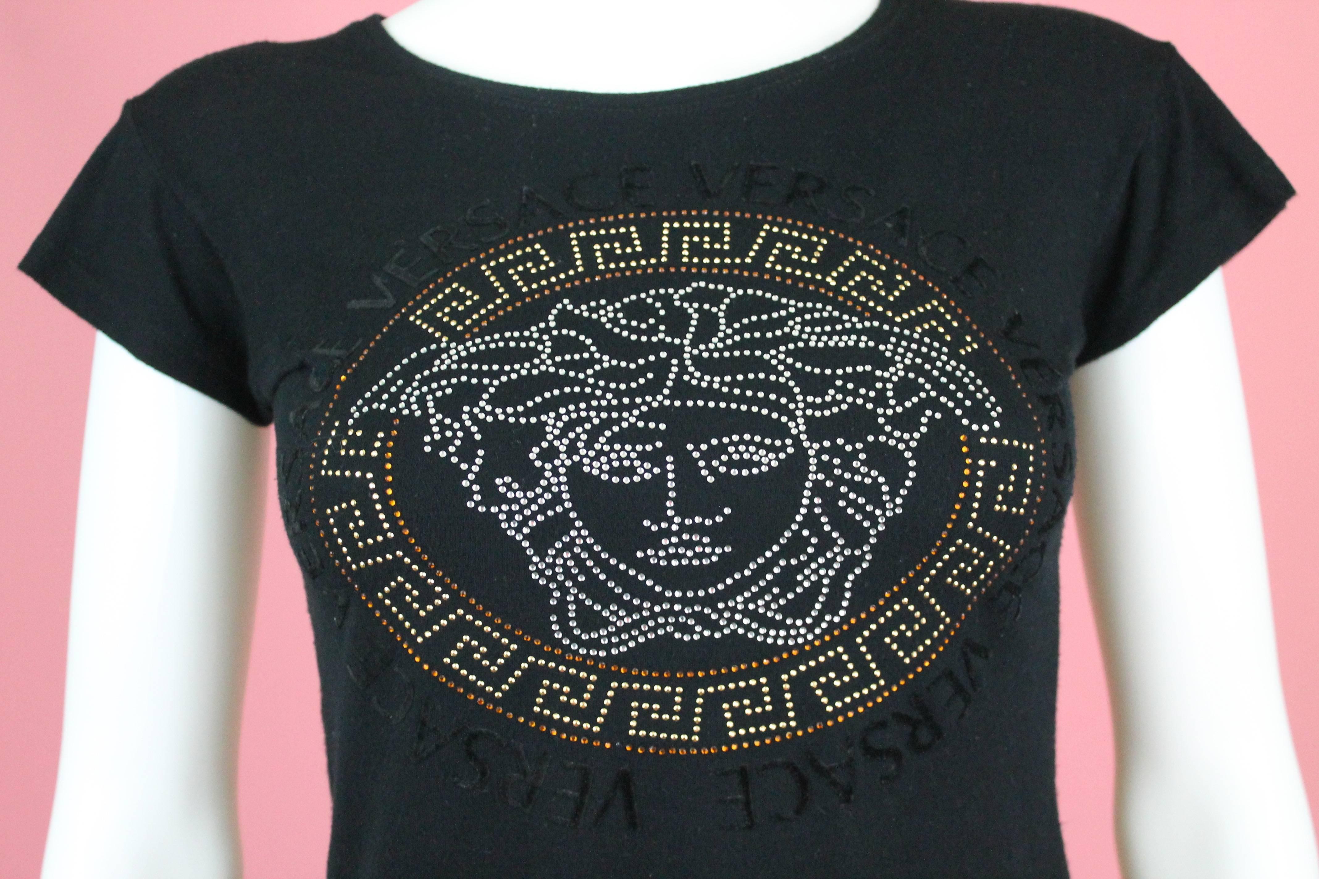 -Stretchy and light Summer shirt from Versace 
-Features iconic Medusa logo in multicolor crystals with Greek key design outline. 
-Has Versace font logo in flocked velvet
-Shirt has care tag cut off, however, 100% authentic
-Sized M
-Made in