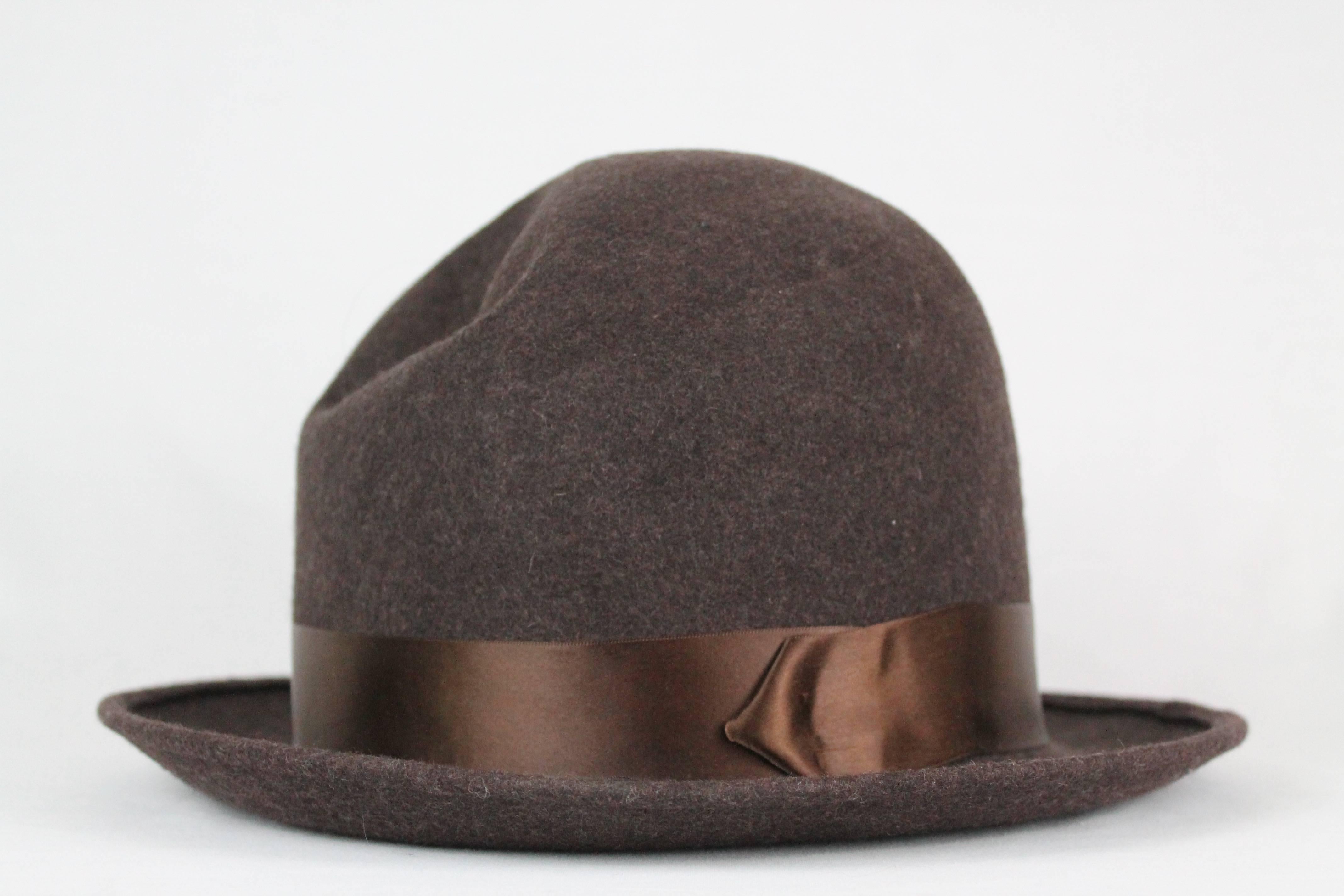 -Beautiful chocolate brown bowler from Christian Dior
-Made of 100% wool, bowler features brown ribbon  around the crown 
-Hat can be indented (as seen in pictures) or smoothed out to create round bowler look.
-Has a Peruvian hat look to it 
-It is