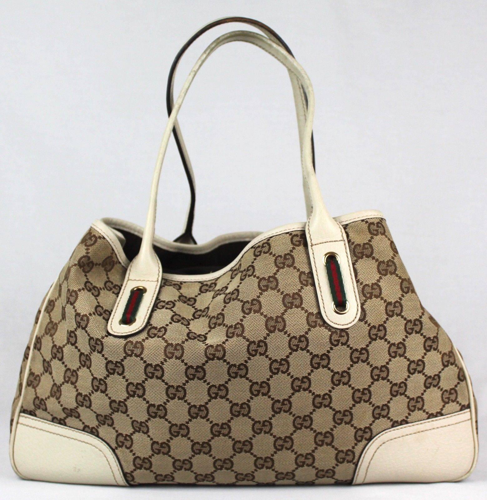 -Beautiful every day Princey Tote bag from Gucci
-Bag features iconic GG monogram in canvas with white leather corners and accents 
-Has tri-colored Gucci bow in the front 
-Closes with a snap strap and has 1 inner zip pocket 
-Comes with original