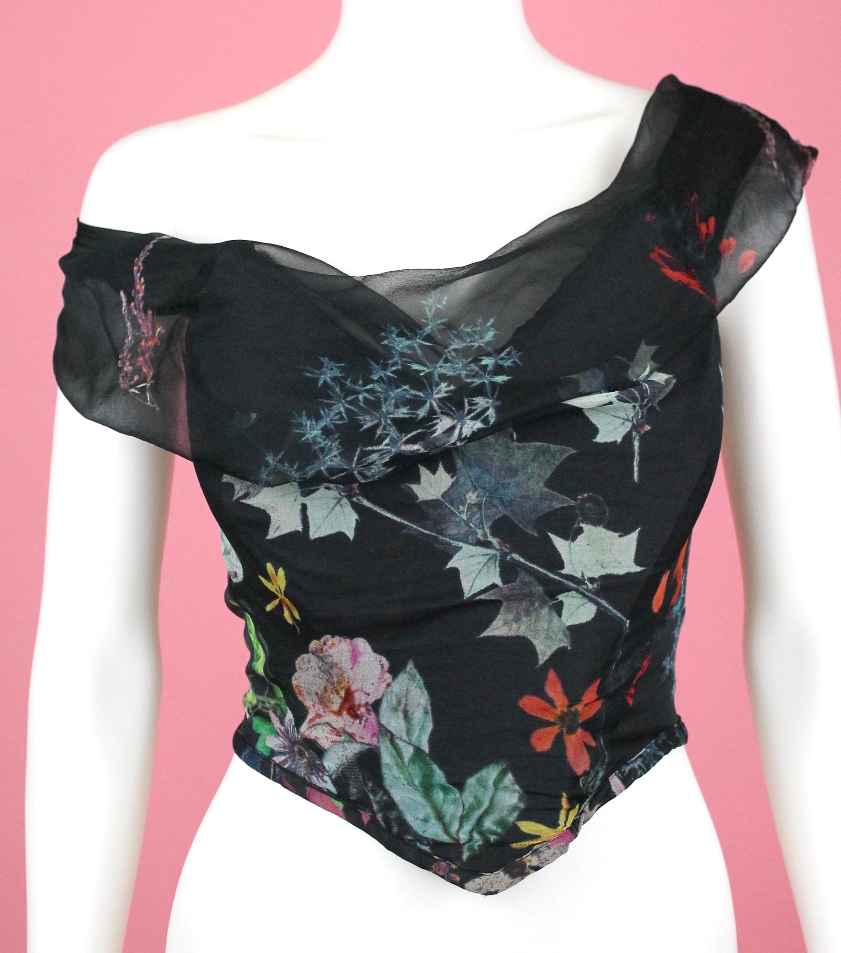 -Beautiful corset from Vivienne Westwood Red Label
-Made of 100% silk with 100% cotton lining
-Corset is decorated with autumnal leaves.
-The draping on the bust has a floating effect, the silk fabric used is sheer on this part. 
-Side panels to