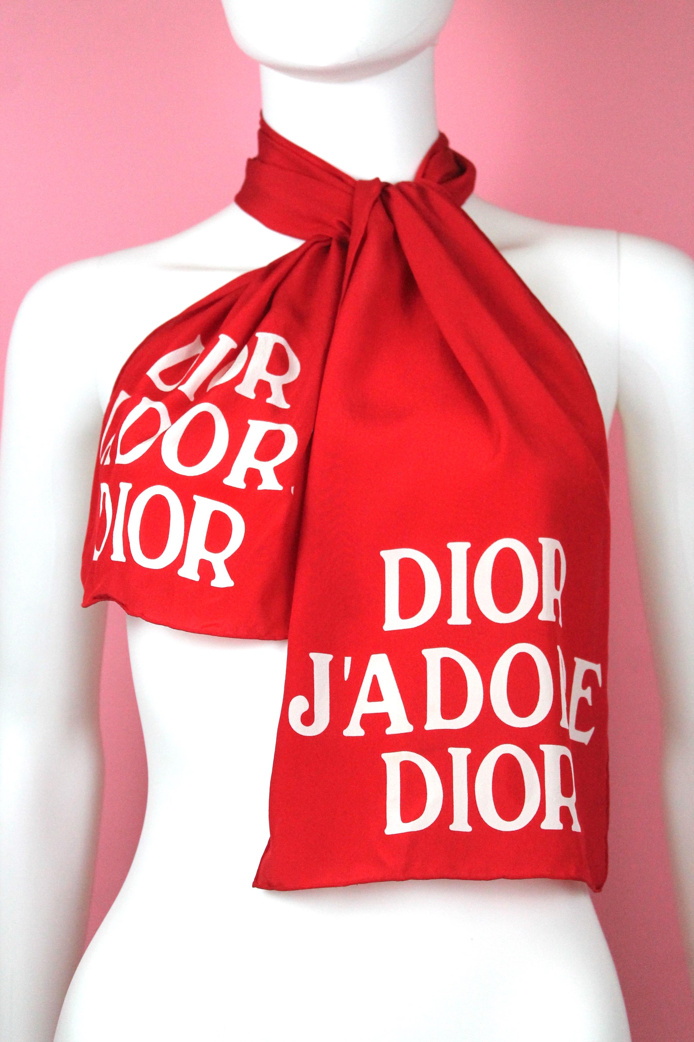 -Beautiful long silk scarf from Christian Dior, in vibrant red color. 
-Has Dior J'adore Dior on one end and the same font with logo on the other end. 
-From early 2000's
-Great light feel with sheer effect.

Approximate Measurements:
-10