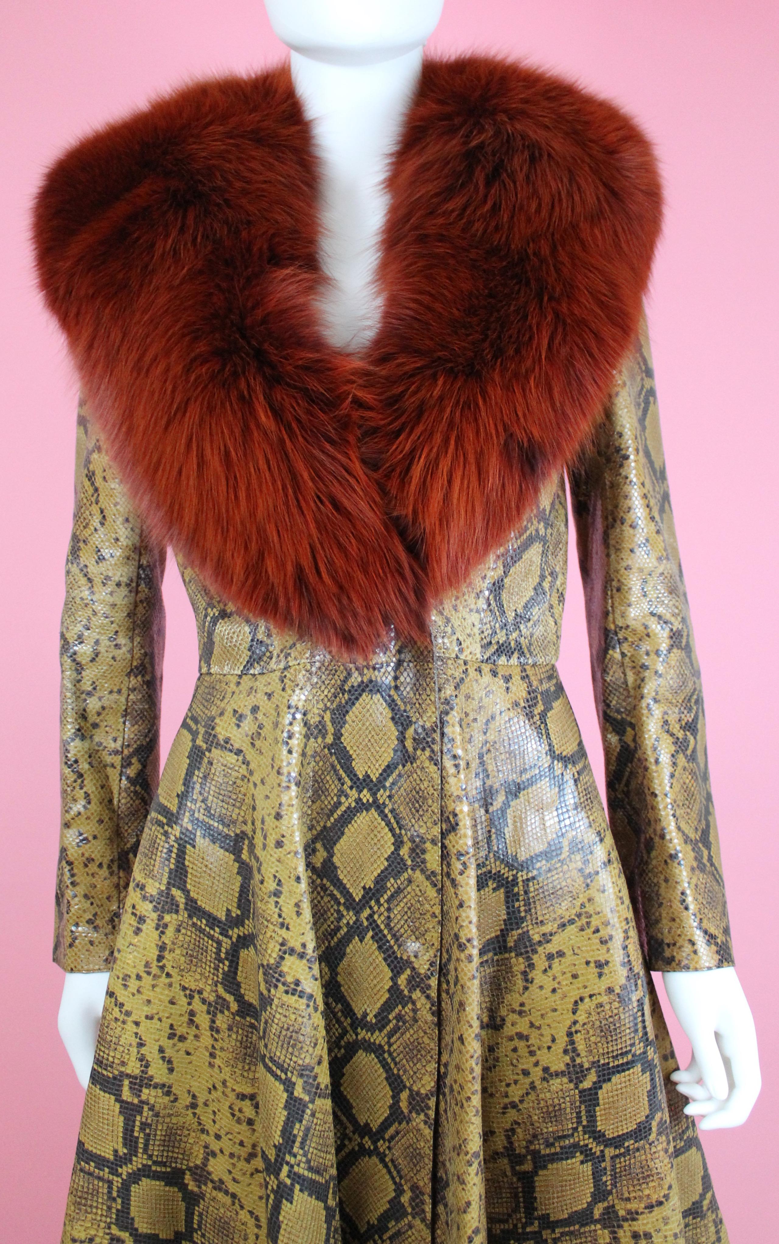 -Python embossed lamb leather with fox fur collar from Alexander McQueen Pre-AW16
-Leather feels like actual python, fur collar is supple
-Cinched at the waist
-Sized US 2 / IT 38 
-Double breasted, snap closures
-Made in Italy

Approximate