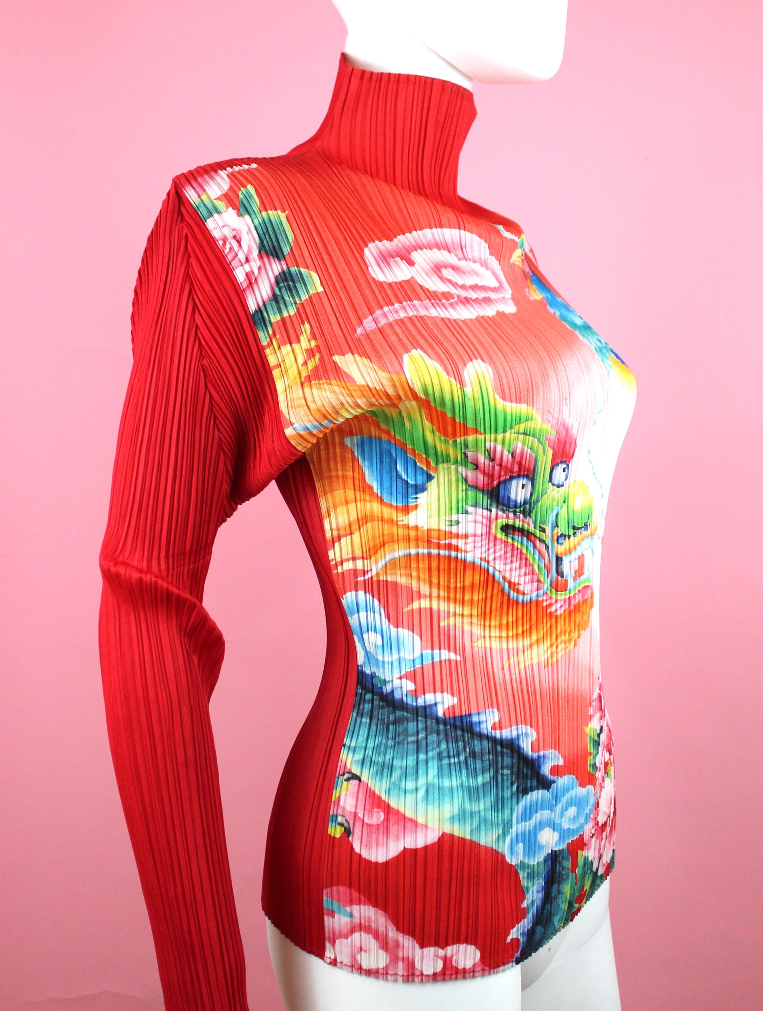 Pleats Please Shirt by Issey Miyake
-Red pleated shirt with Chinese dragon and Pheasant 
-Limited edition print
-Vibrant Chinese red color
-Sized Japanese 4, equivalent to M/L
-Made in Japan
-Lots of stretch

Measurements
-Total length: 26