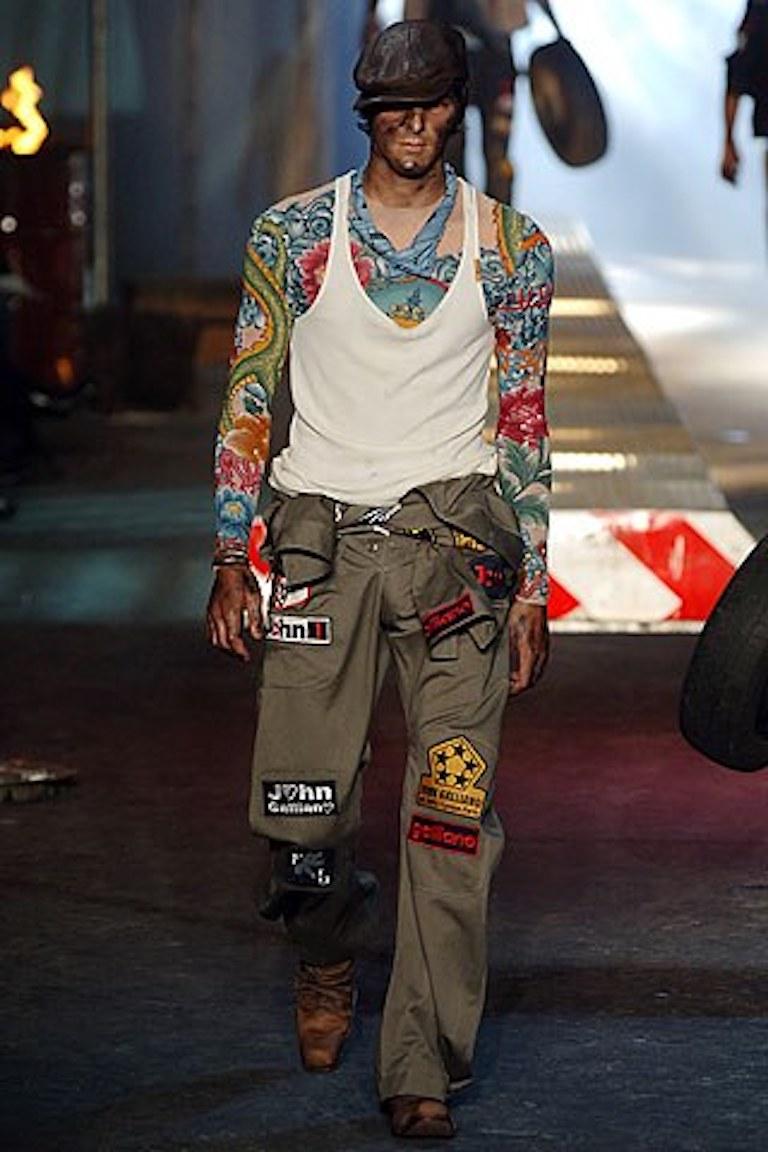 -Gorgeous tattoo shirt from John Galliano men's Spring Summer 2006
-Has Indian deity print on front and Ohm print on the back 
-Shirt is sheer, similar to the pieces out now by DSquared  
-Sized M, made in France
-Plenty of stretch, meant to stick