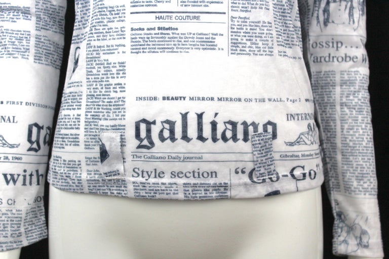 -Galliano newspaper print all over
-Semi sheer
-White cotton with light navy font
-Sized M
-Made in Italy
-Has a bit of stretch

Measurements
-length : 21 
-bust : 16
-sleeve  length: 23

Condition:
-Excellent, 100% authentic. New with tags. 
