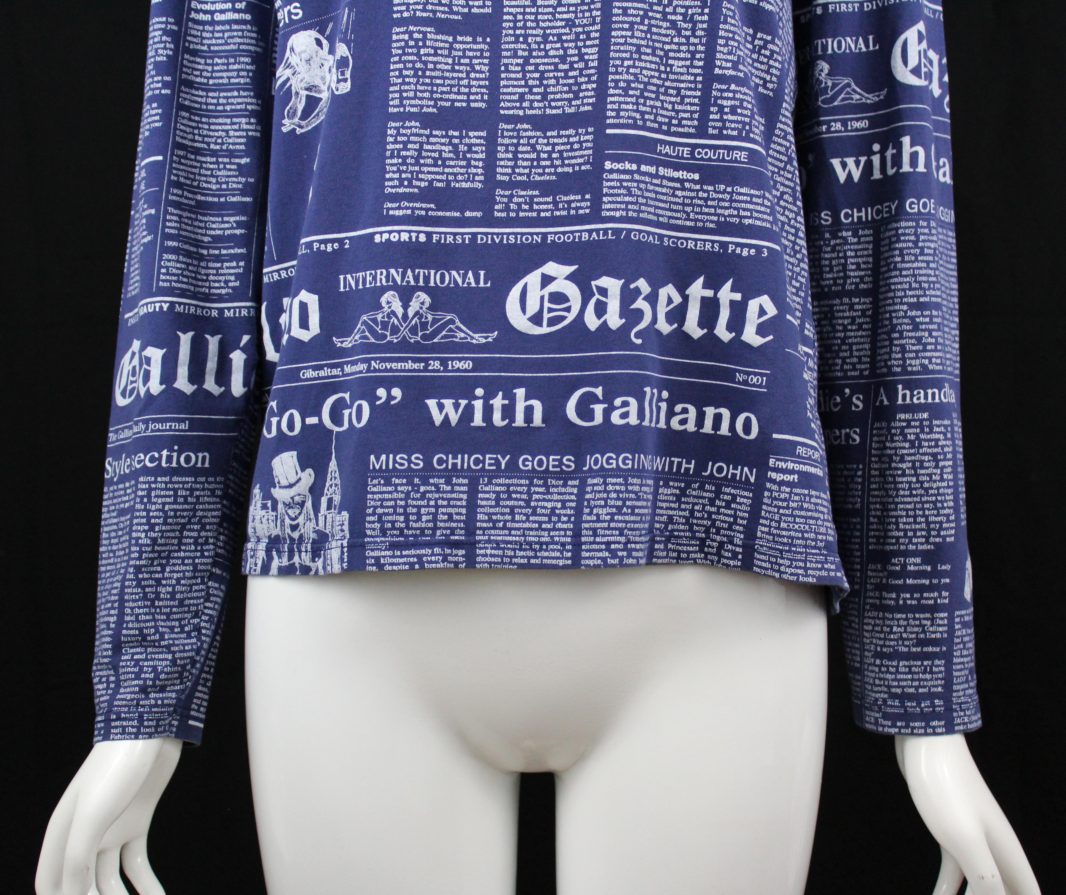 -Galliano newspaper print all over
-Blue cotton with white font
-Sized S
-Made in Italy
-Has stretch 

Measurements
-length : 23
-bust : 18
-sleeve  length: 24

Condition:
-Excellent, 100% authentic.
