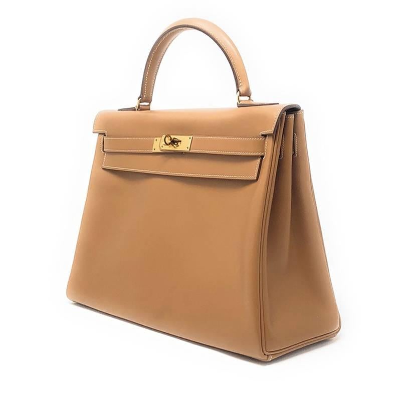 This Vintage but ever so stunning Hermes Kelly 32 Bag in Brown with gold hardware is truly a classic piece. 

Its previously enjoyed but very good condition from year 1981.

Its classic, chic and elegant for everyday and every occasion.

Hermes bags
