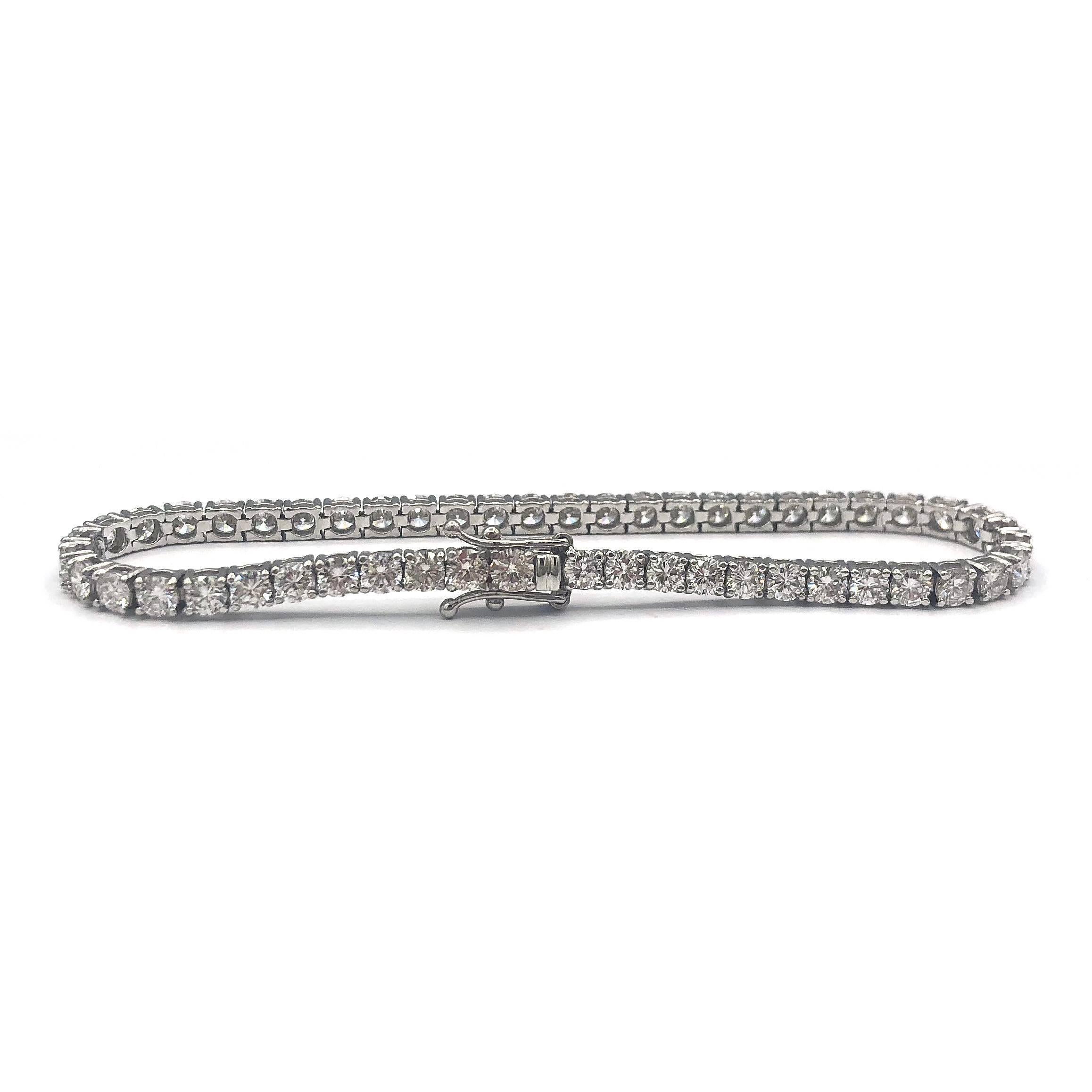 Absolutely amazing Tennis Bracelet with 51 round diamonds
Features approximately 7.65 carats of 51 Round Diamonds VS-S1 clarity mounted in 18K White Gold.

7 inches long, .01 inches wide.

weights 11.28 grams 