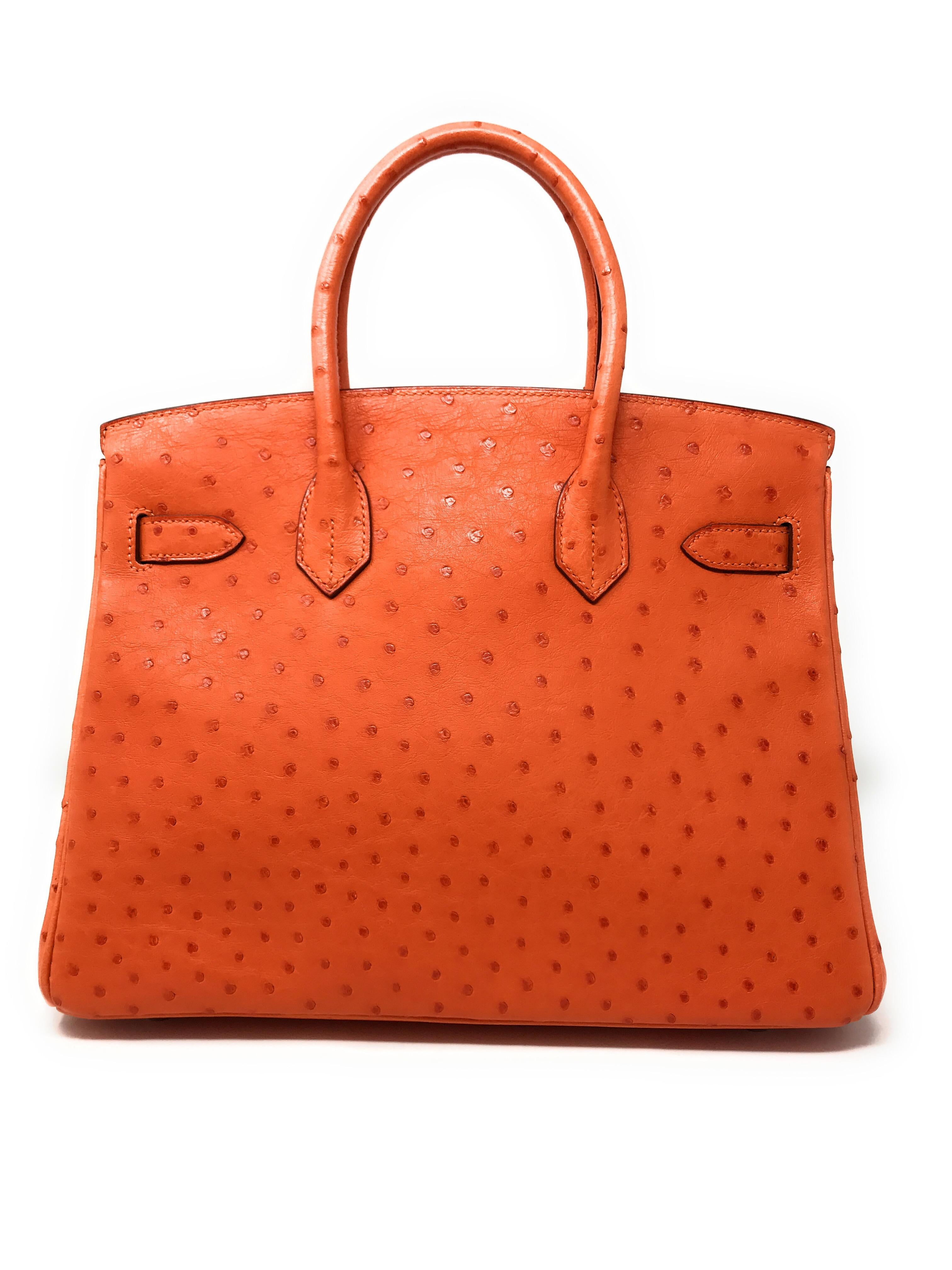 Bright and fresh Hermes Tangerine Orange! This compact size Birkin bag is a must have for any collector. It’s the 30cm size which makes it versatile to enjoy day or night. This bag is crafted in the Hermes signature color in ostrich skin, that was