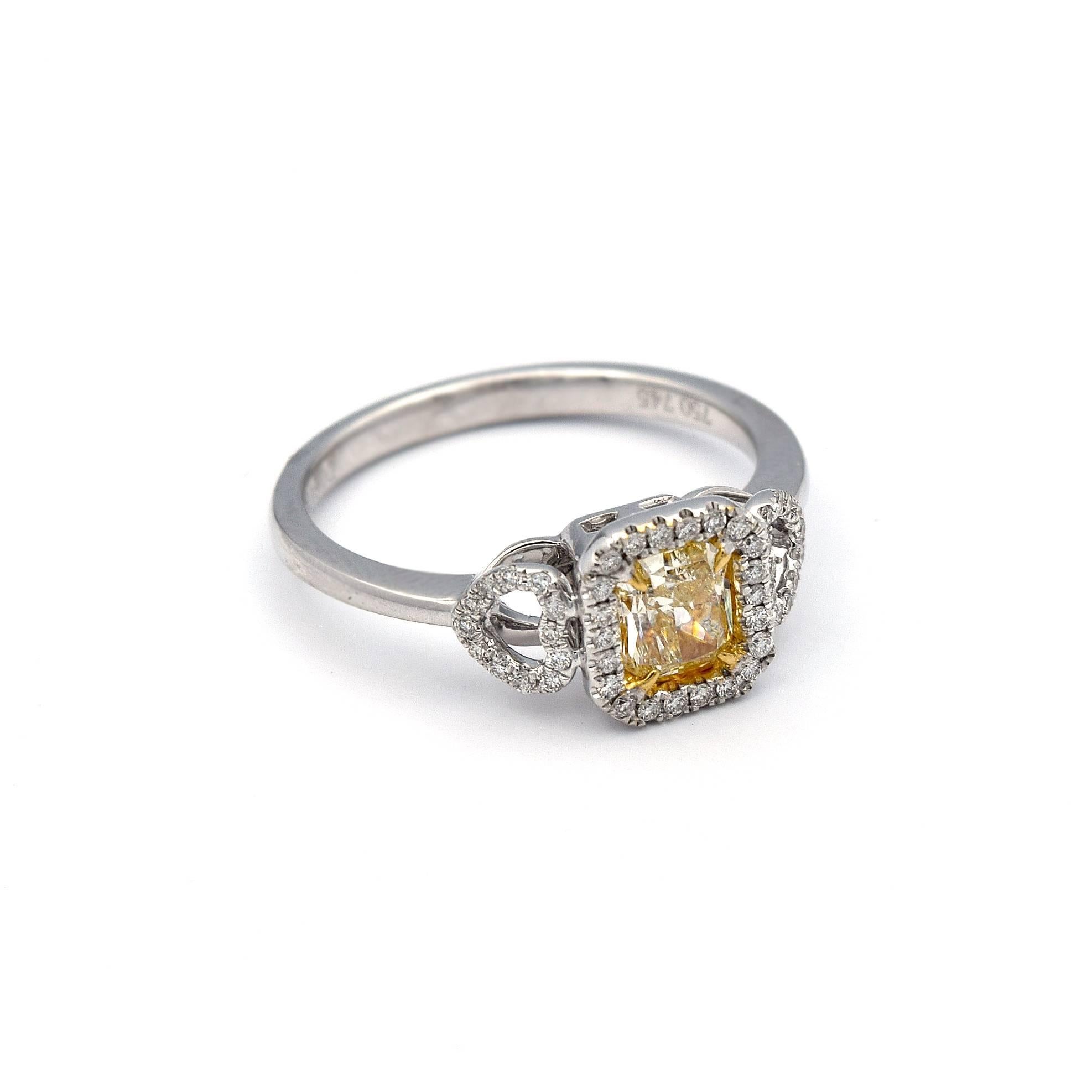 Women's or Men's 0.64 Carat Radiant Natural Yellow Diamond Ring in 18 Karat White Gold For Sale