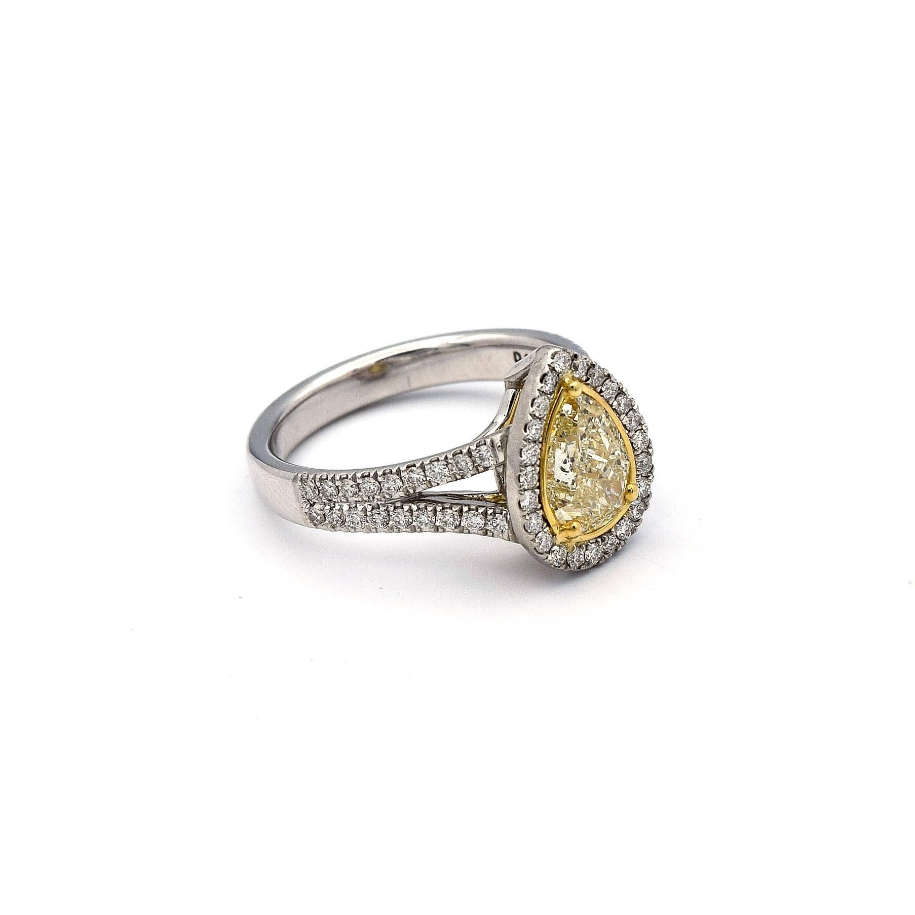 This Pear Shaped Natural Yellow Diamond weights 1.00ct, along with 59 White Pave Diamonds weighting 0.43ct. This is truly a beautifully crafted ring, for an occasion. 

Mounted in 14K White and Yellow Gold, giving the ring a total weight of 5.48
