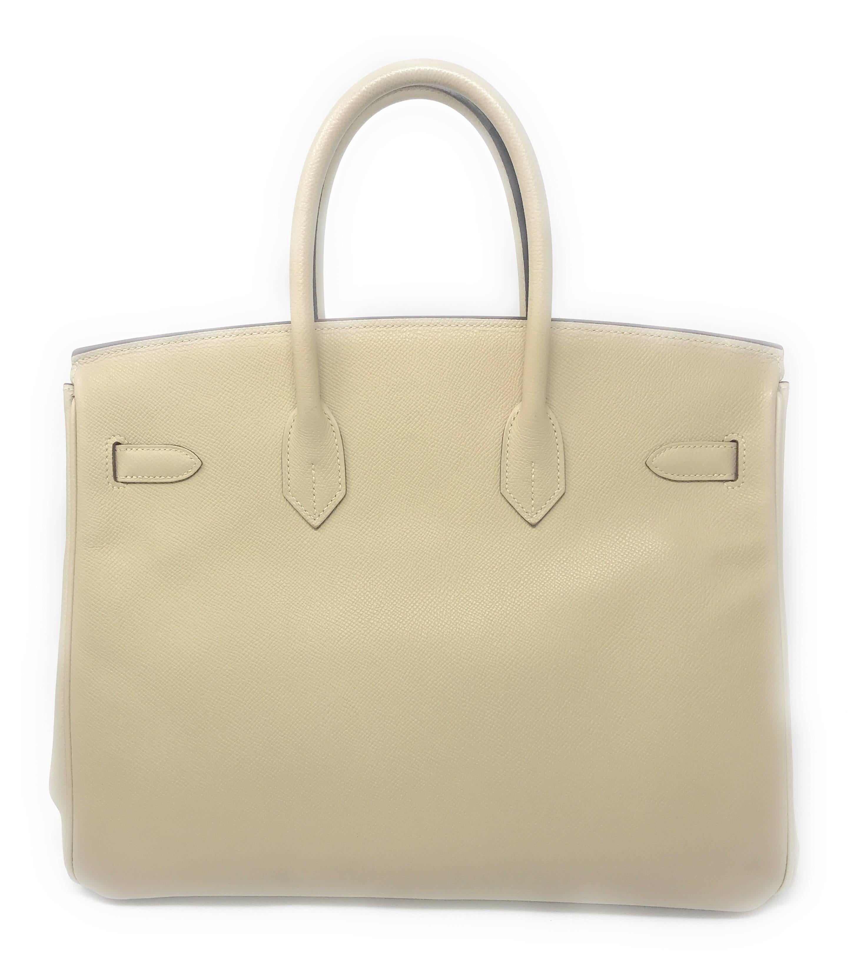 The beauty of Hermes Epsom leather is exhibited in this gorgeous 35cm Birkin Bag. It is a neutral color called Parchemin, meaning parchment, combined with gold plated hardware for a truly elegant look.

This is a preowned bag, which has been