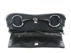 Gucci black canvas monogram horsebit clutch bag