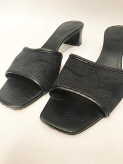 Gucci black leather and monogram canvas Mules.