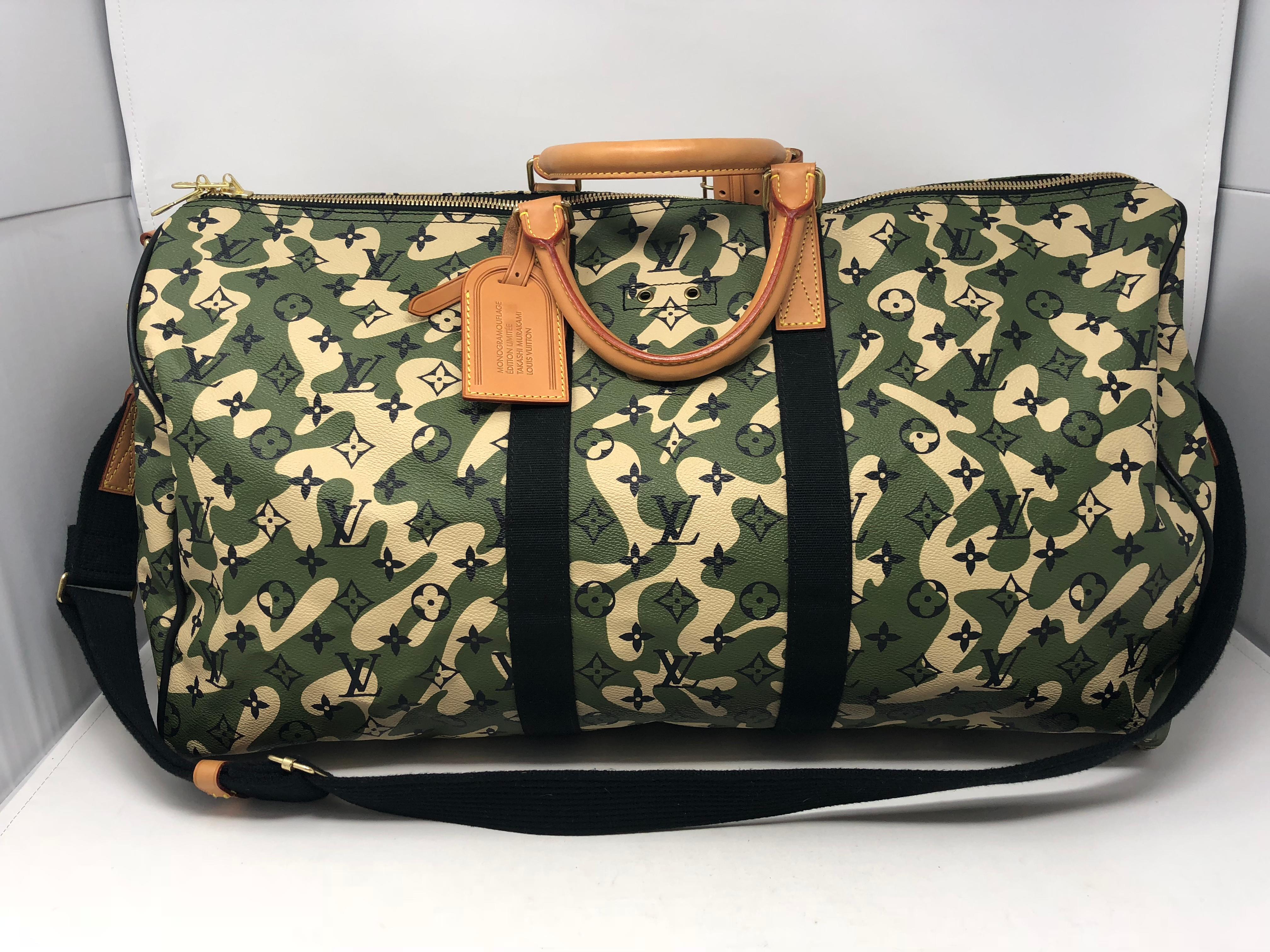 Louis Vuitton Monogramouflage Canvas Keepall 55 Bandouliere with strap. Very limited and extremely rare Japanese Pop artist Takashi Murakami and Marc Jacobs  designed this bag. They reinvented the classic monogram with a camouflage motif. Great