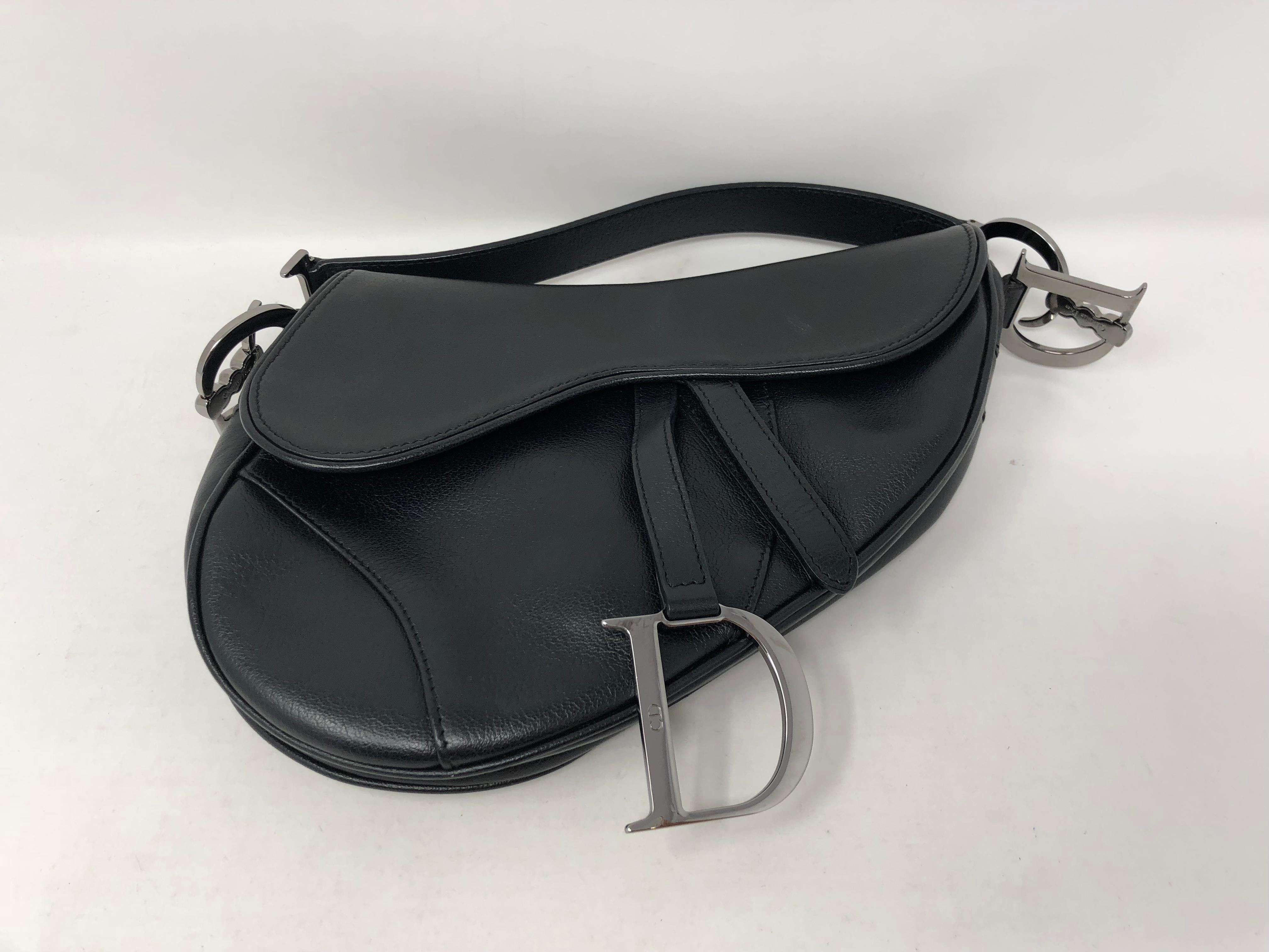 Christian Dior Black Saddle Bag in leather with silver hardware. This is the 
