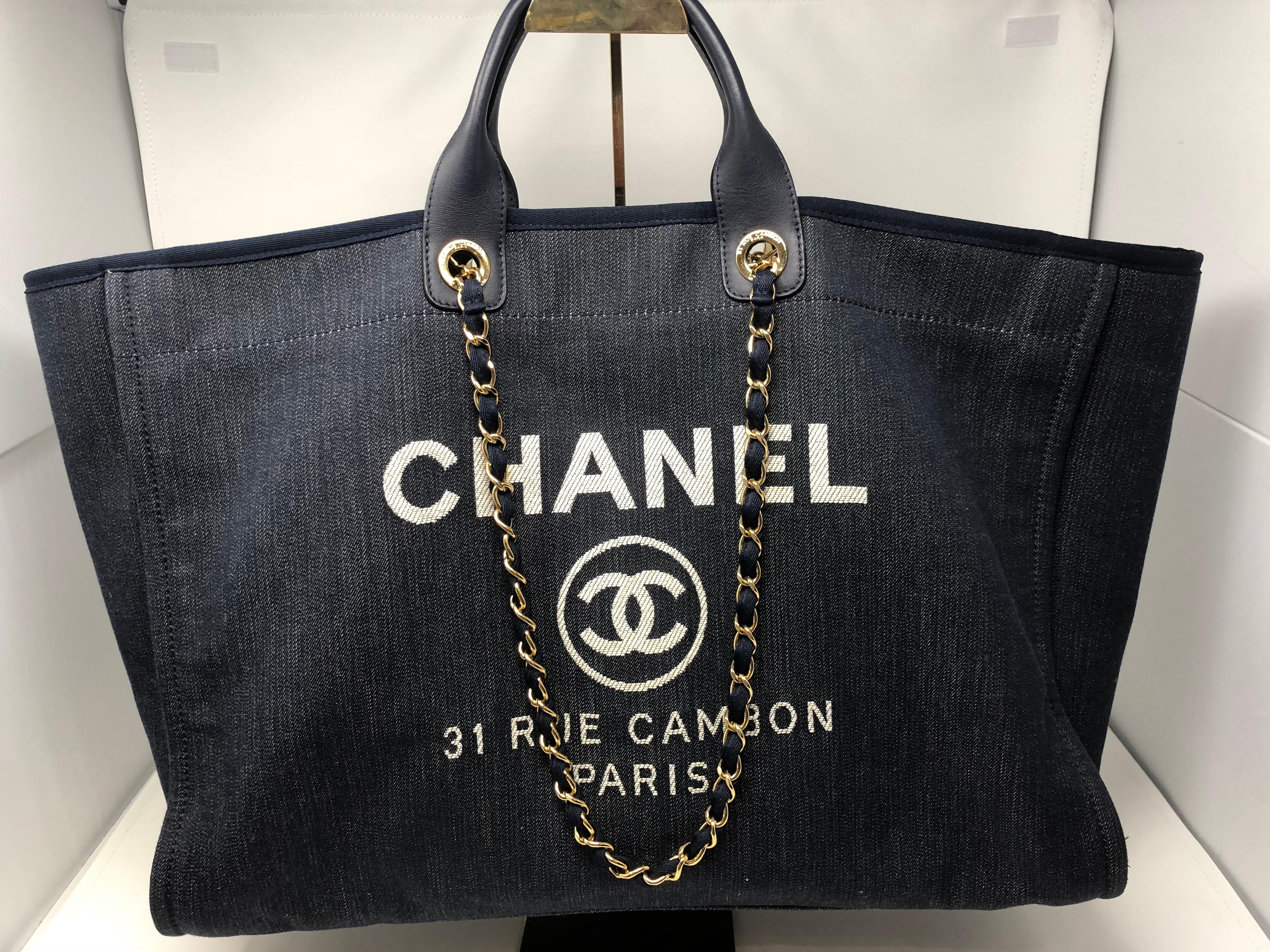 Chanel Deauville XL Tote in denim blue with leather handles. The largest size of the Spring/ Summer Collection 2012 it is one of the hottest bags ever by Chanel. Loved by Fashionistas and Celebs. We offer this bag to a lucky client. Like new