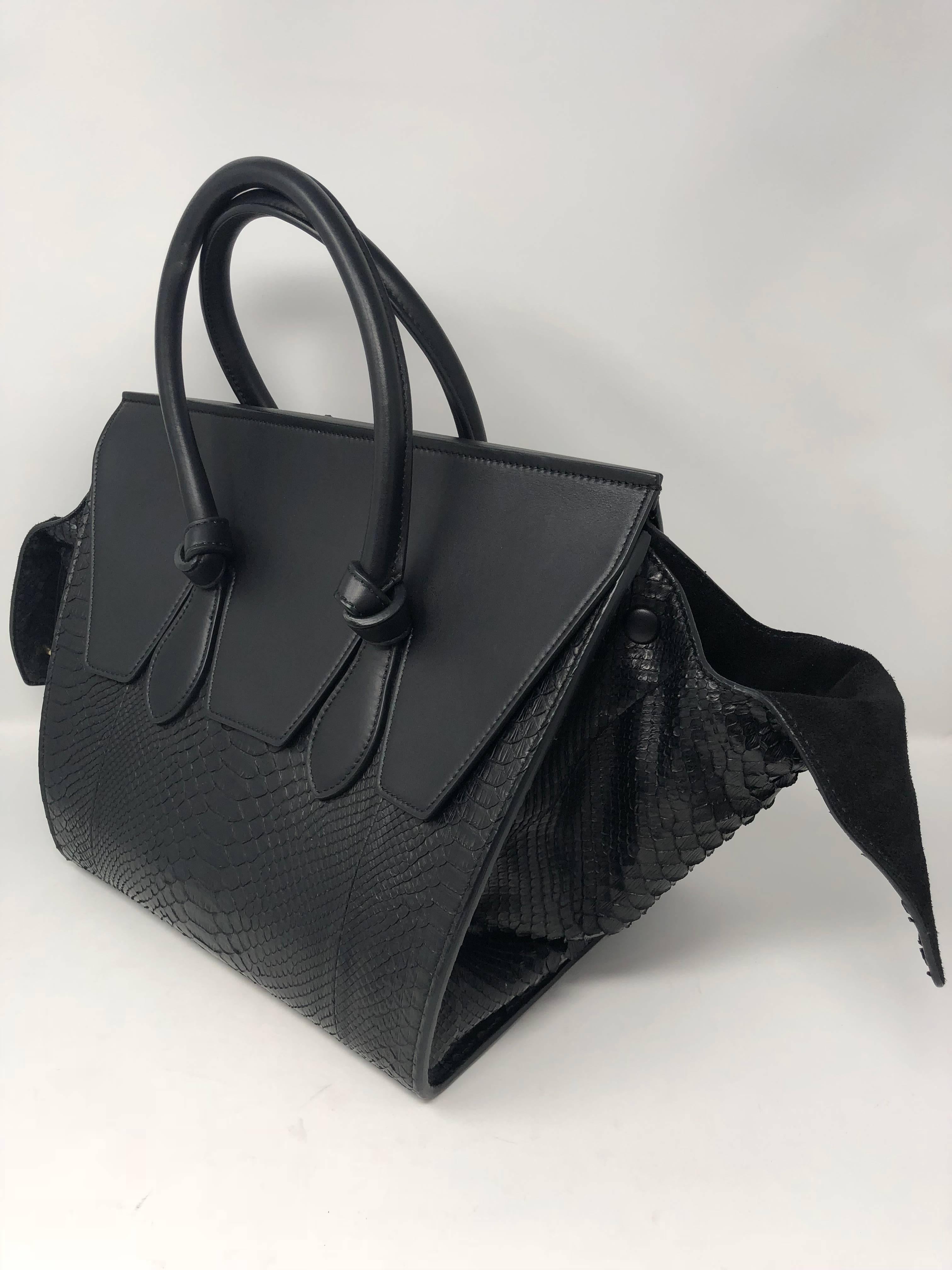 Black Celine Tie Tote in Python leather. Great condition and durable bag. Sides can be tucked in or worn loose. Highly coveted and nice structured purse. 