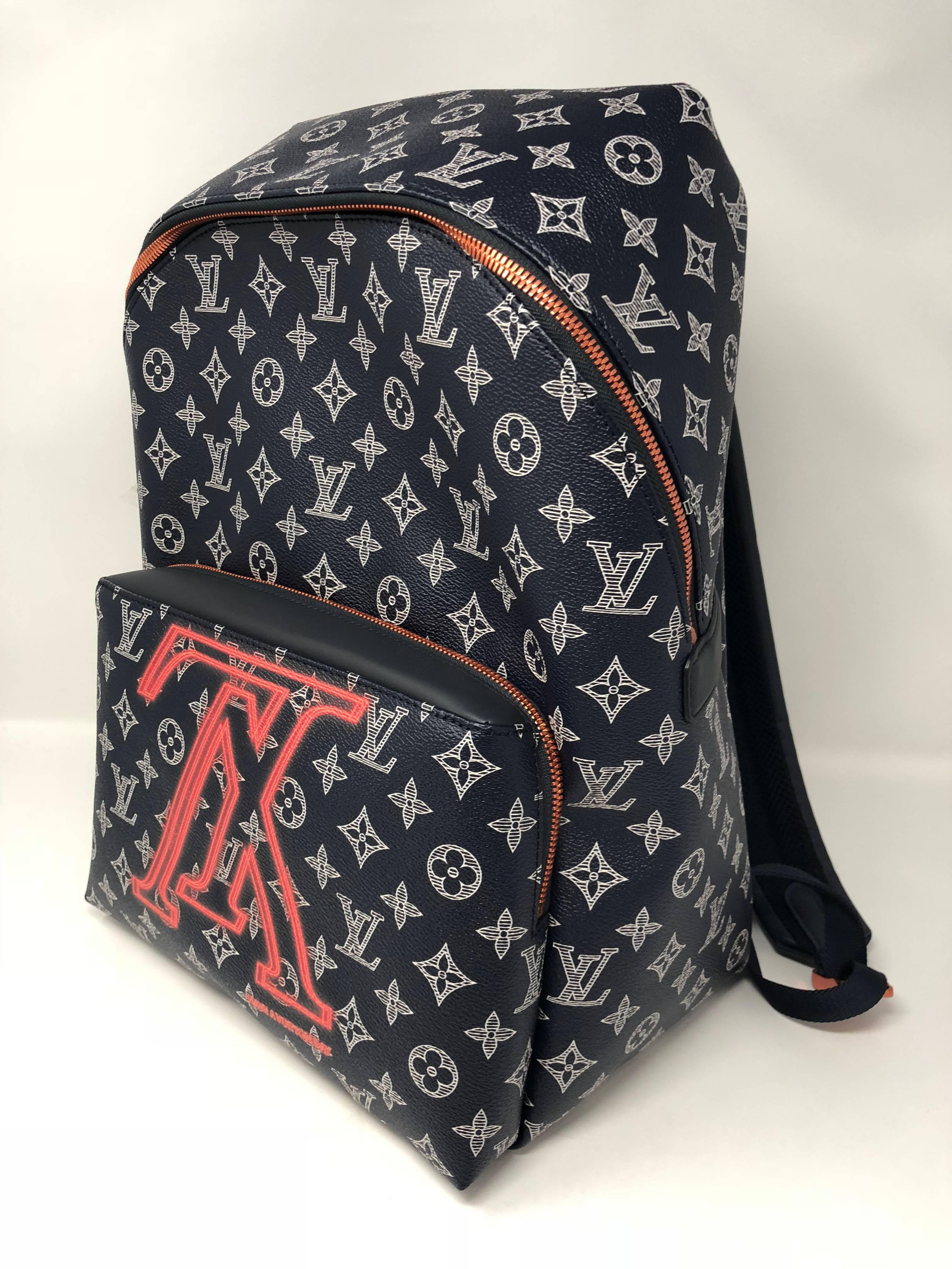 Louis Vuitton Apollo Upside Down Backpack in ink monogram. Brand new with dust cover and LV box. Color is navy monogram with pink lettering. The Upside down signature in pink. Sold out collection in high demand. 