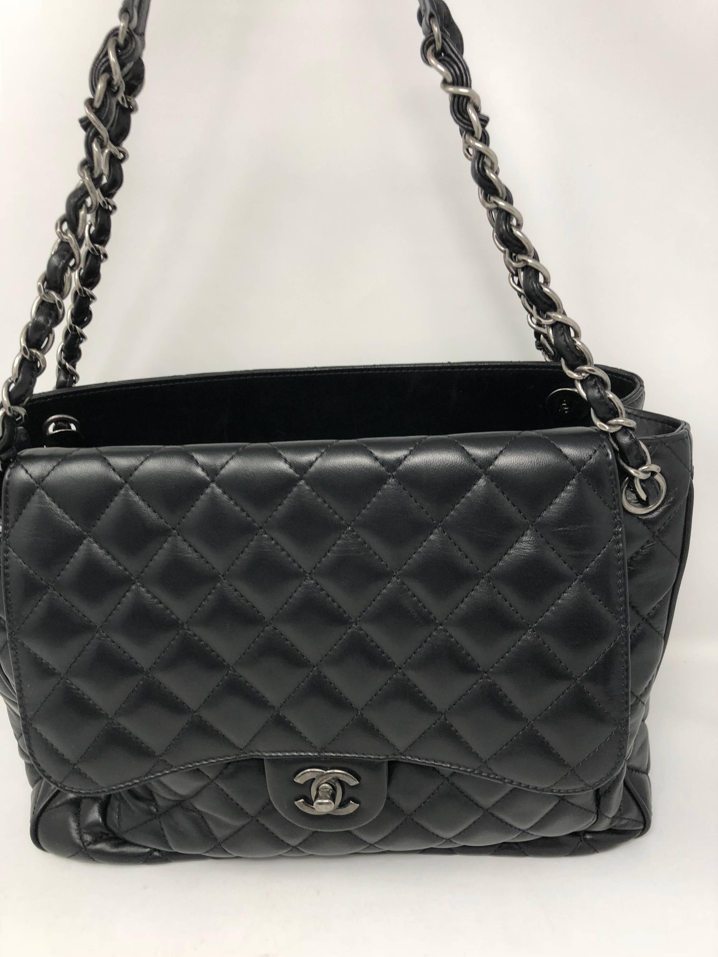 Black Chanel tote with antique silver hardware. Supple soft lambskin leather in mint condition. The hardware gives it a more modern look. 