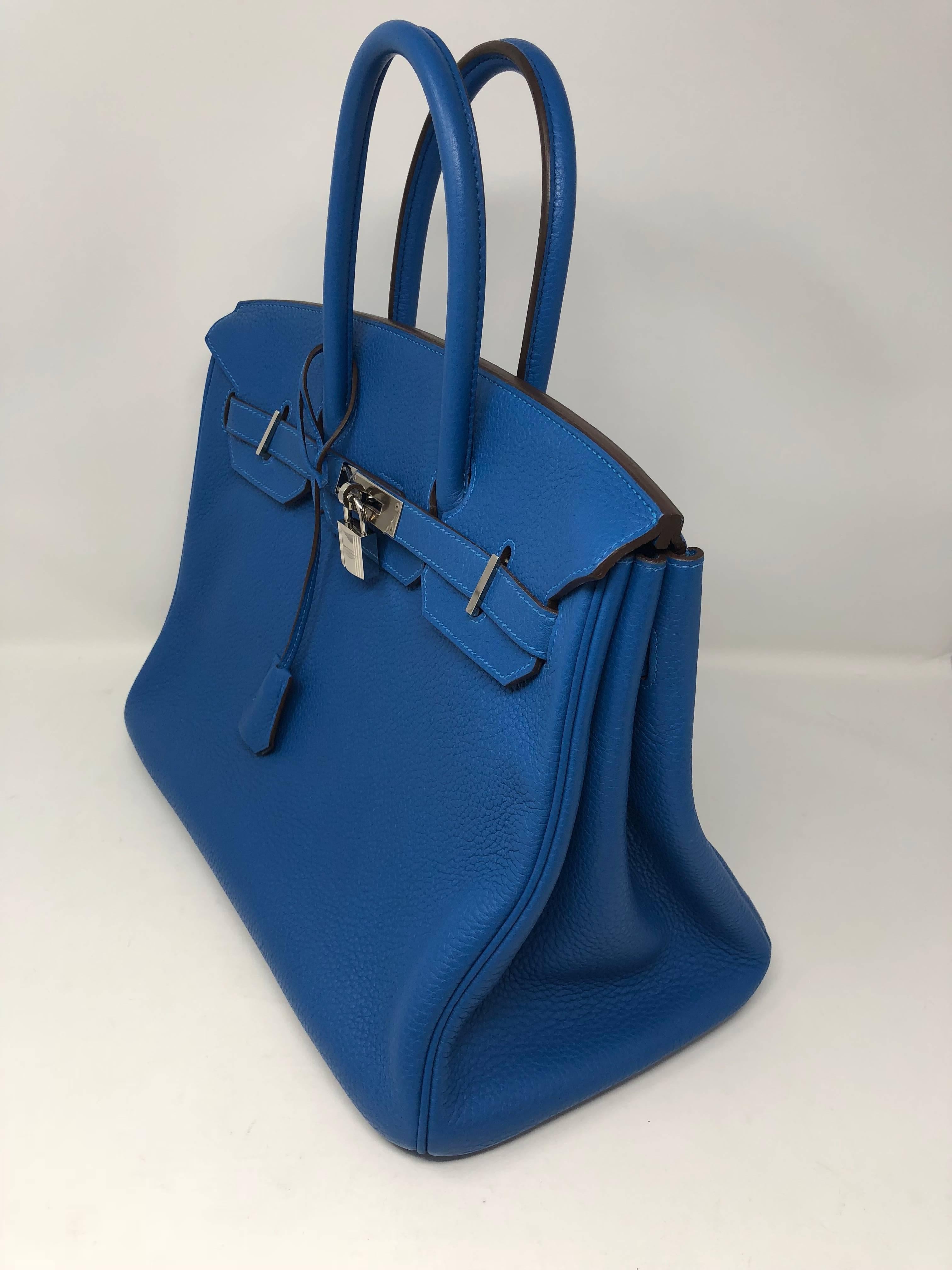 Beautiful Blue Mykonos Hermes Birkin 35 with palladium hardware. Bag is in mint condition with little wear. Color is rare and hard to find. Guaranteed authentic and comes with clochette, keys, dust cover and rain jacket. 