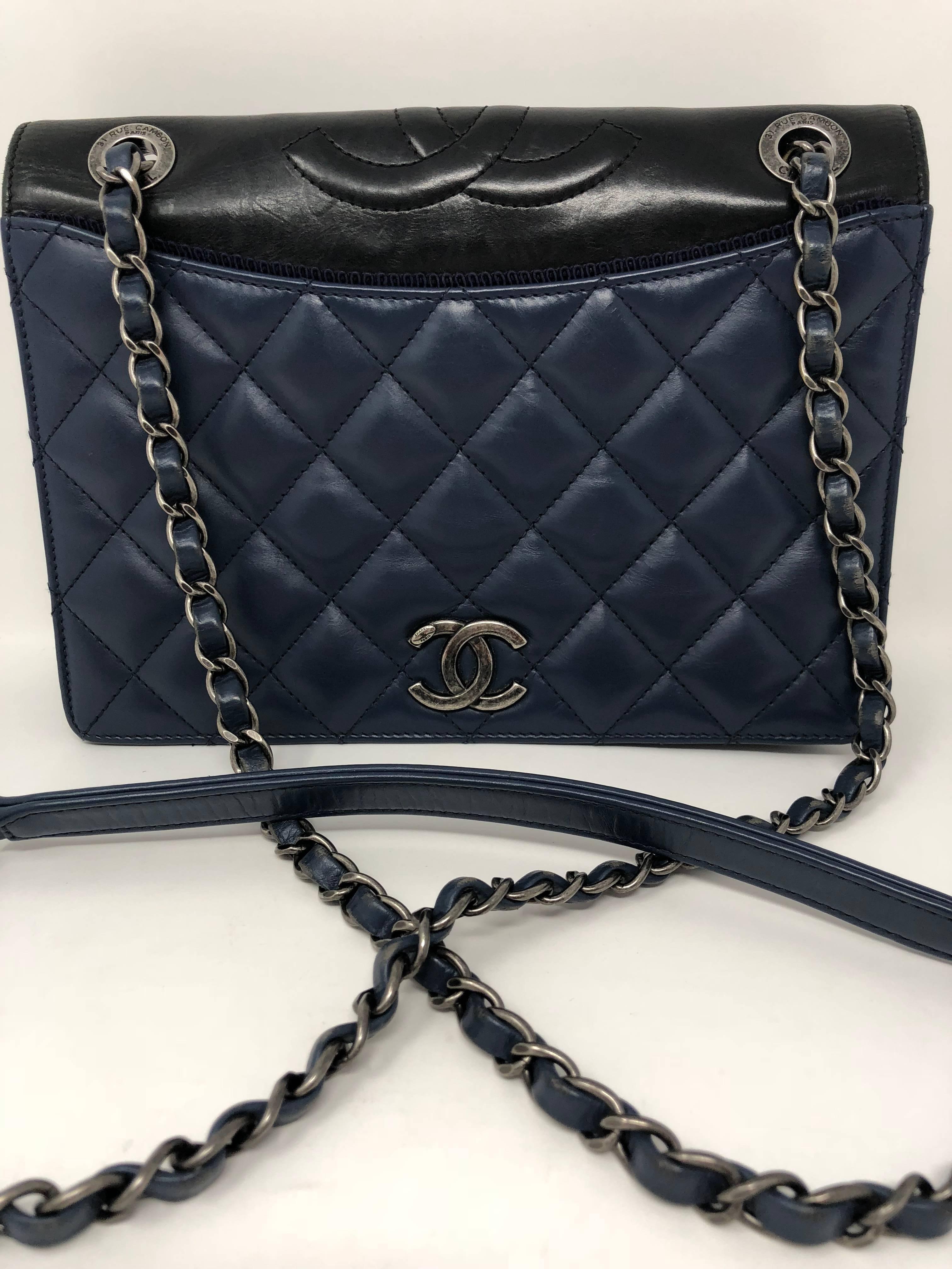 Blue quilted leather flap bag with antique silver-tone hardware with black leather trim. The chain links are adjustable to wear crossbody or as a shoulder bag. Burgundy interior. From the Fall 2015 Collection. Guaranteed authentic.