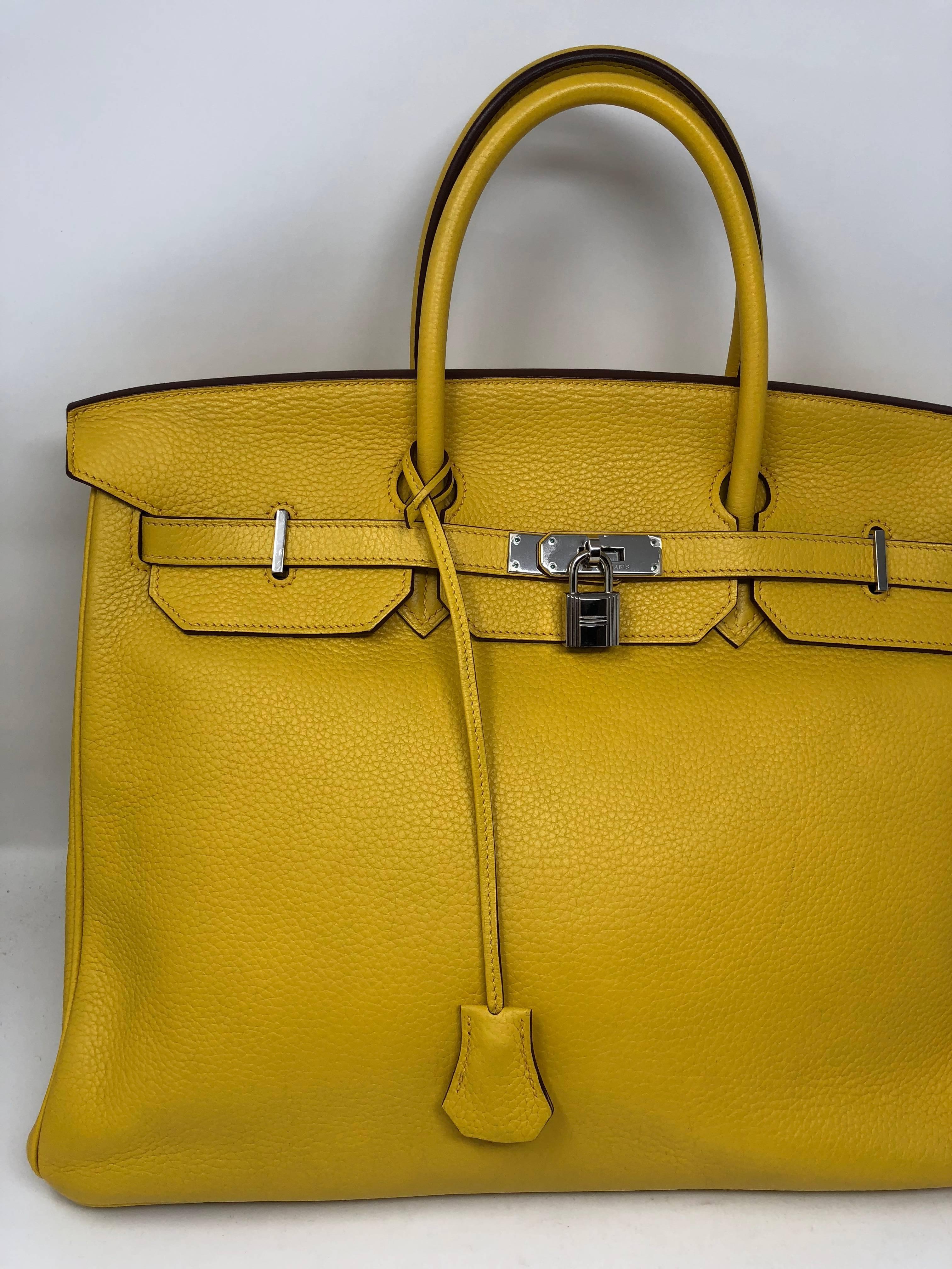 Hermes Yellow Soleil Birkin 40 in Veau Taurillon Clemence leather. Palladium hardware from 2009 (M square). Bright yellow color pops with any outfit. Good condition. Comes with clochette, keys and dust cover. Guaranteed authentic. 