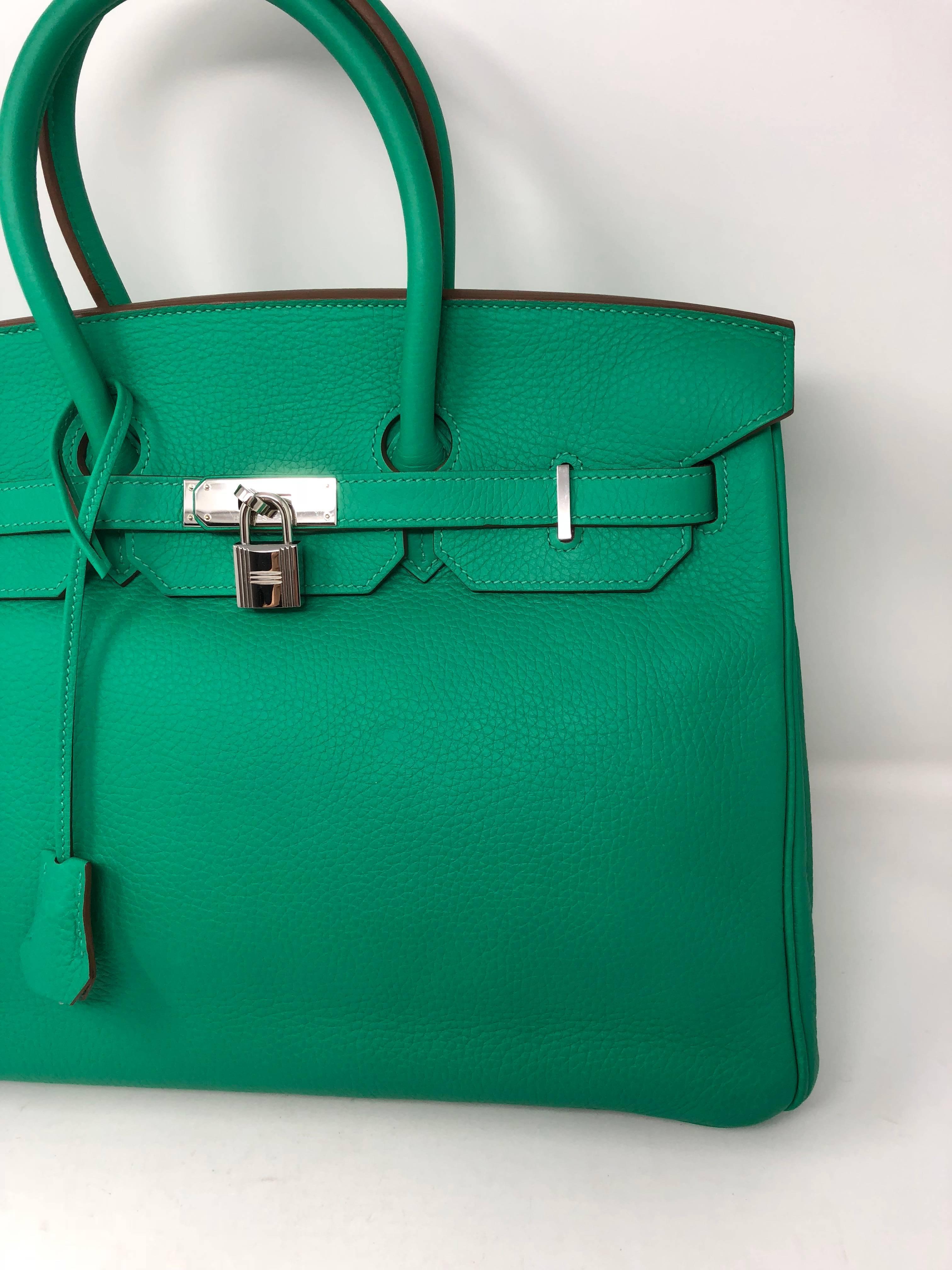 Menthe Green Hermes Birkin 35 in Veau Taurillon Clemence leather. From 2012 (P square) and palladium hardware. Good condition. Comes with clochette, keys and dust cover. Guaranteed authentic. 