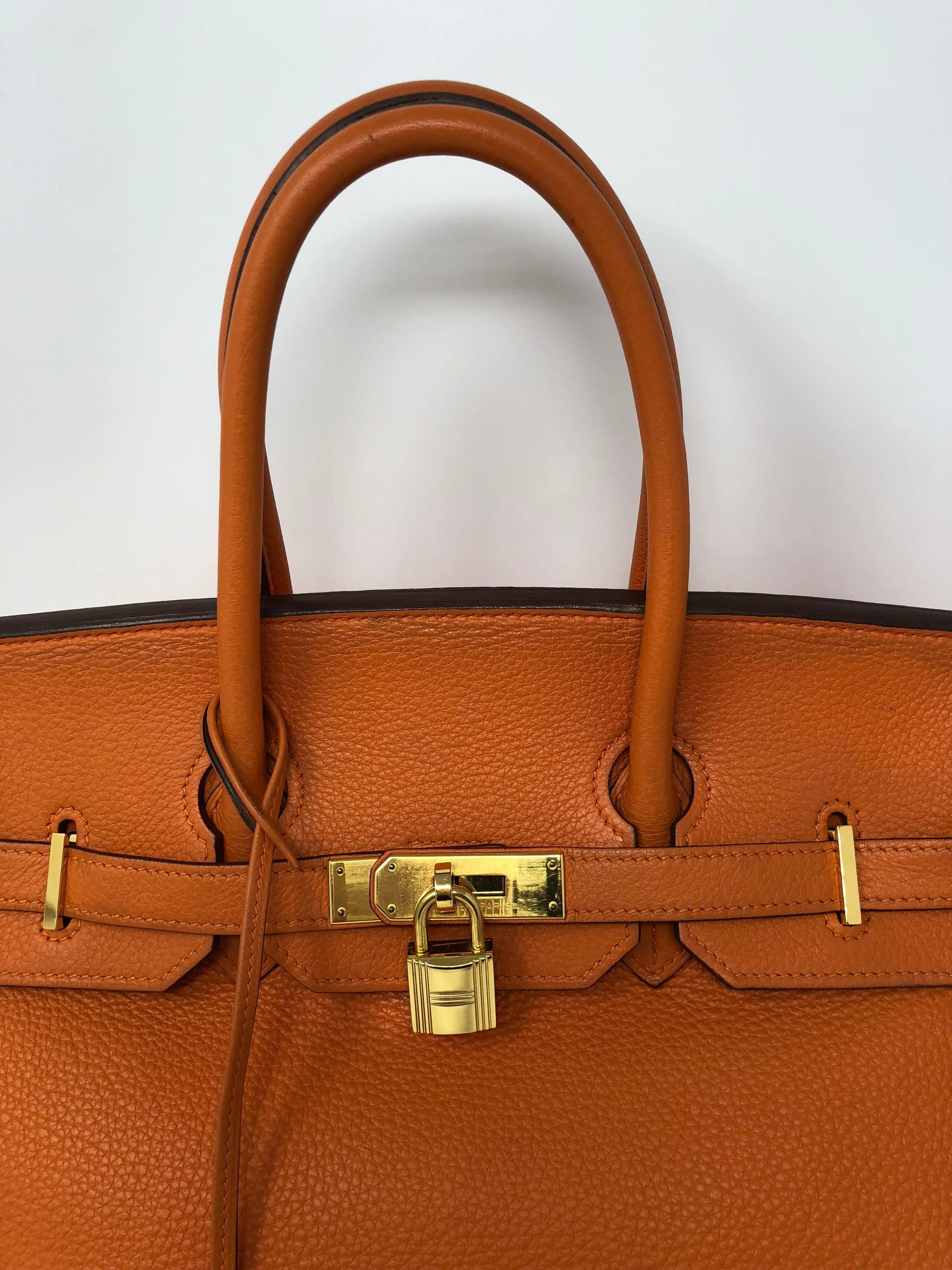 Hermes Birkin Orange 35 with gold hardware. From 2010 (N square) Comes with clochette, keys, and dust cover. Guaranteed authentic. Good condition. 