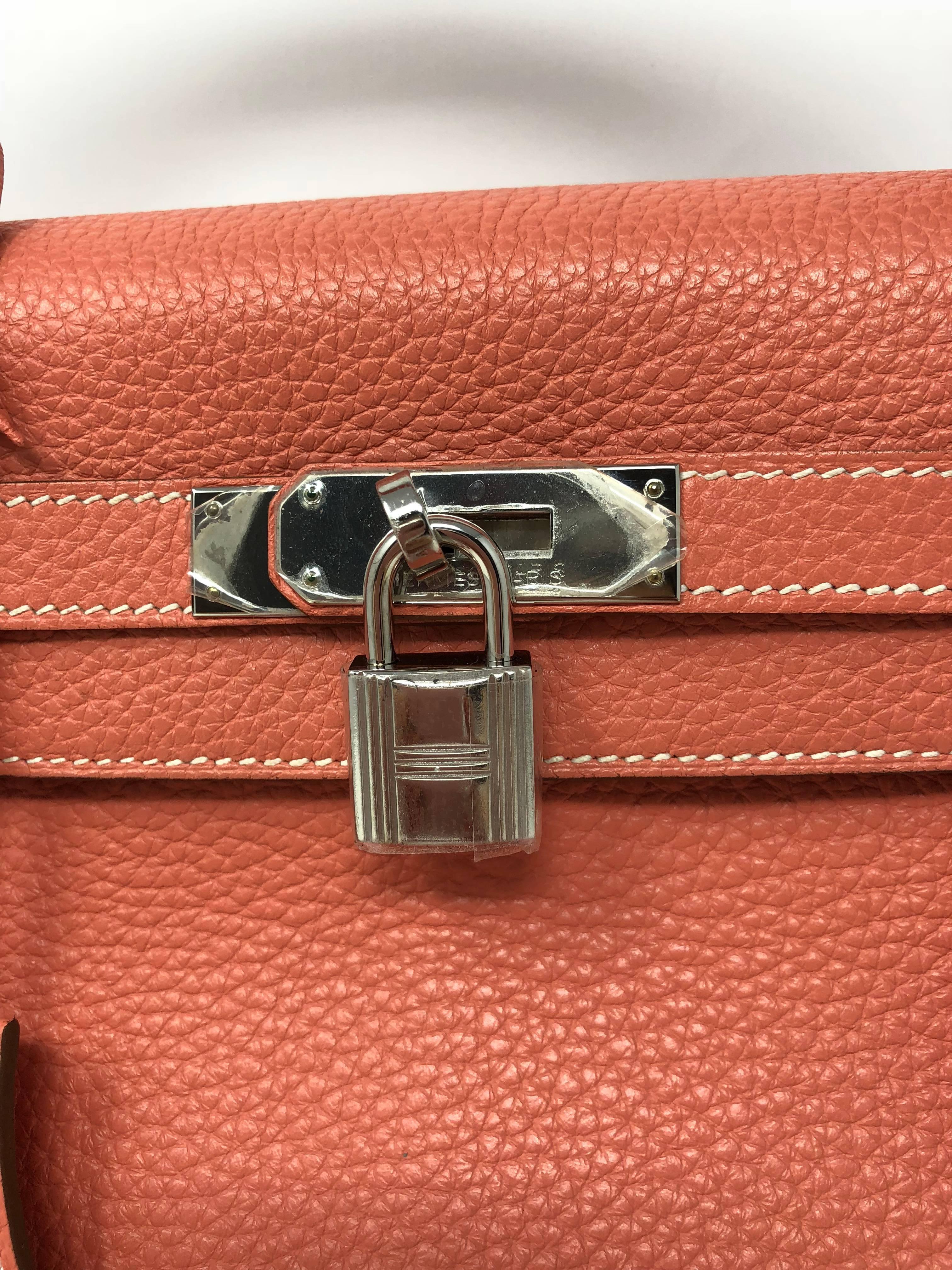 Hermes Kelly Retourne 35 in Crevette pink color. Made of Veau taurillon Clemence leather and palladium hardware. Q square made in 2013. Kelly bag can be worn with or without strap. Mint condition and comes with clochette, keys, and dust cover.