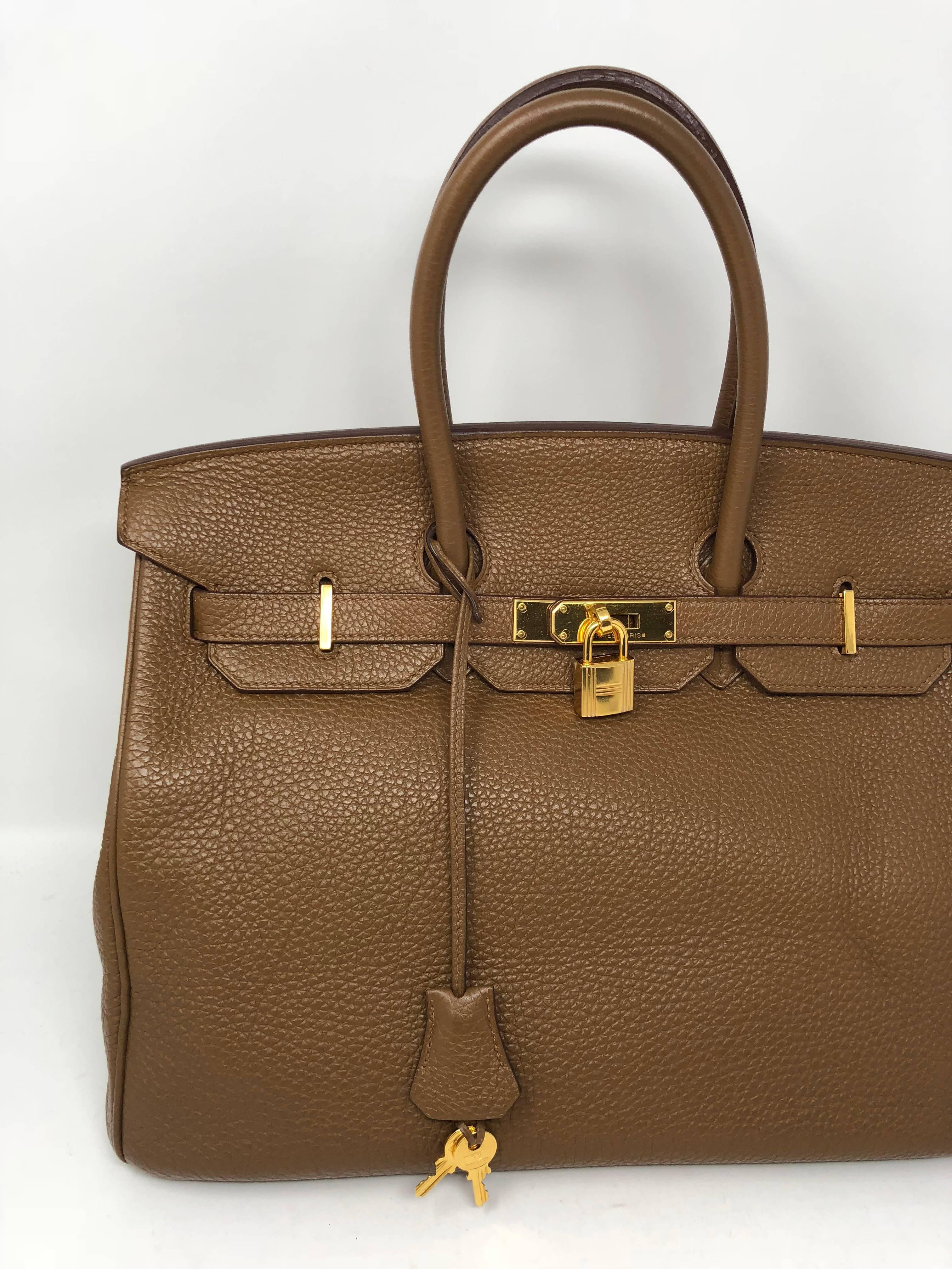 Hermes Birkin 35 in Alezan tan color in Togo leather. The tan/gold color is in gold hardware. Neutral color bag that will go with everything. Mint condition. 