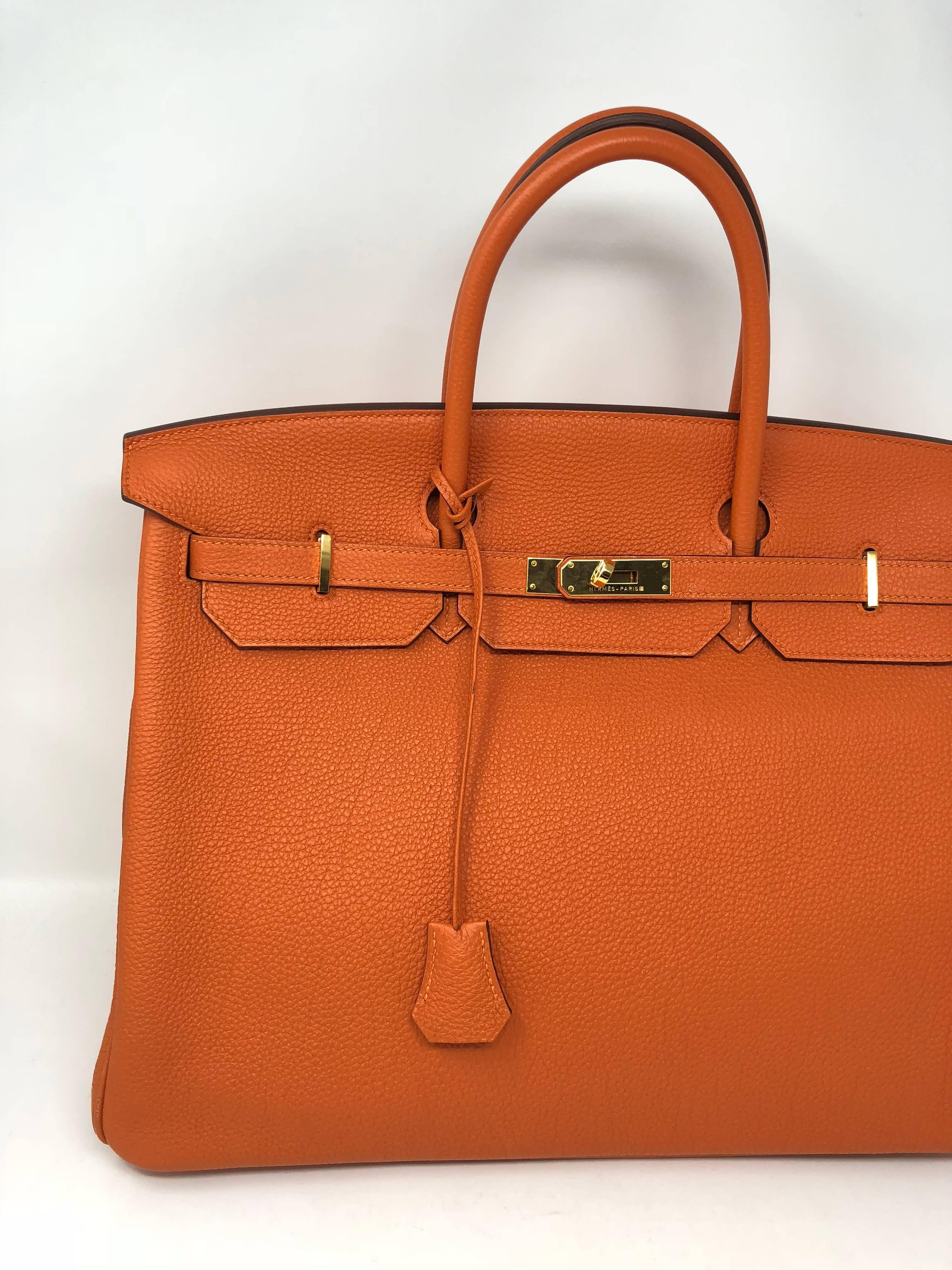 Hermes Birkin 40 Orange Togo with gold hardware. Like new condition. Clochette, keys and dust cover included. Guaranteed Authentic. 