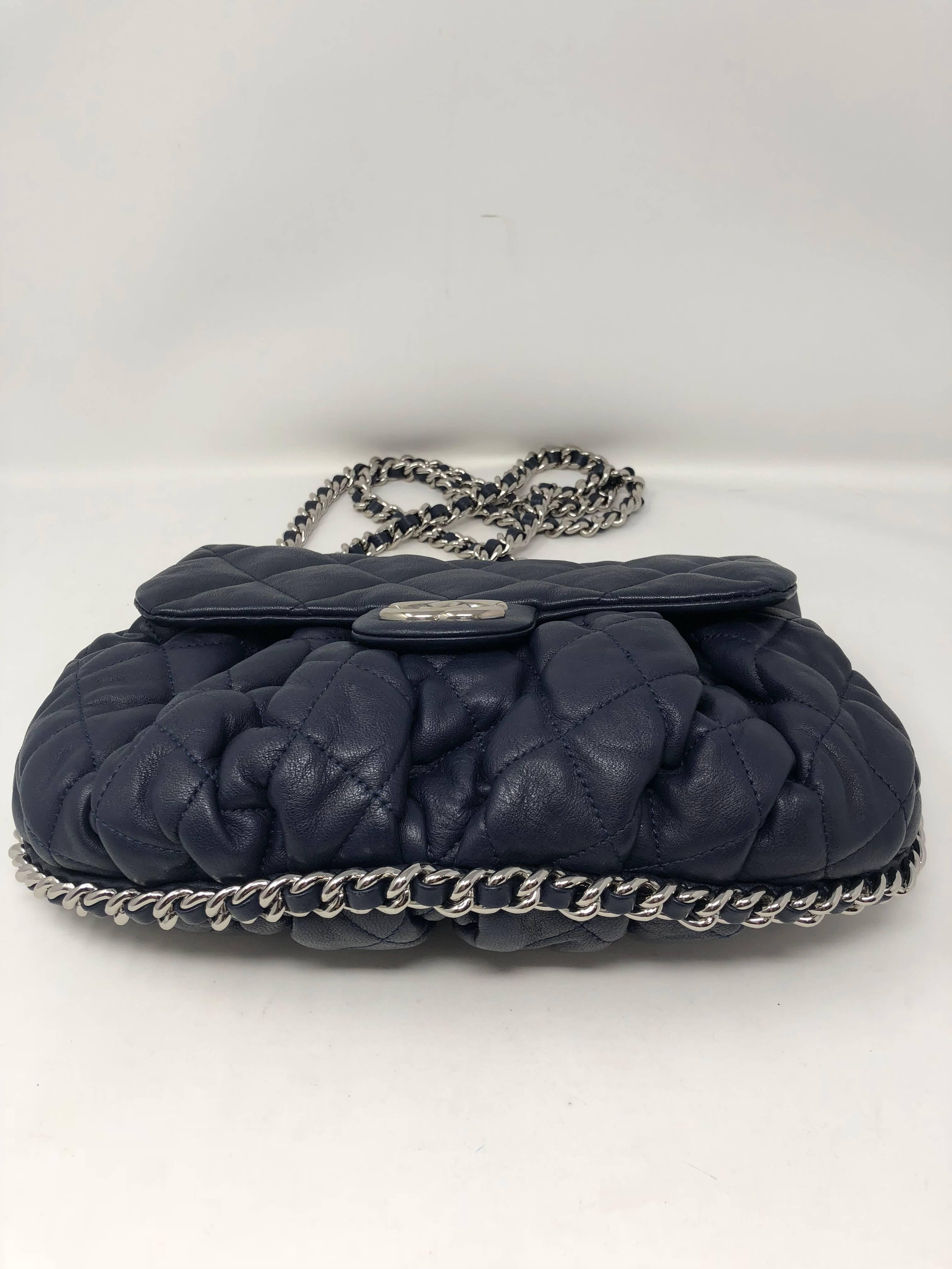 Chanel Navy Chain Around Crossbody bag in navy blue leather. This Chanel looks like is was never used. Mint like new condition. From the Cruise collection released in 2011. Silver hardware is shiny and interior of bag is clean with no wear. Comes