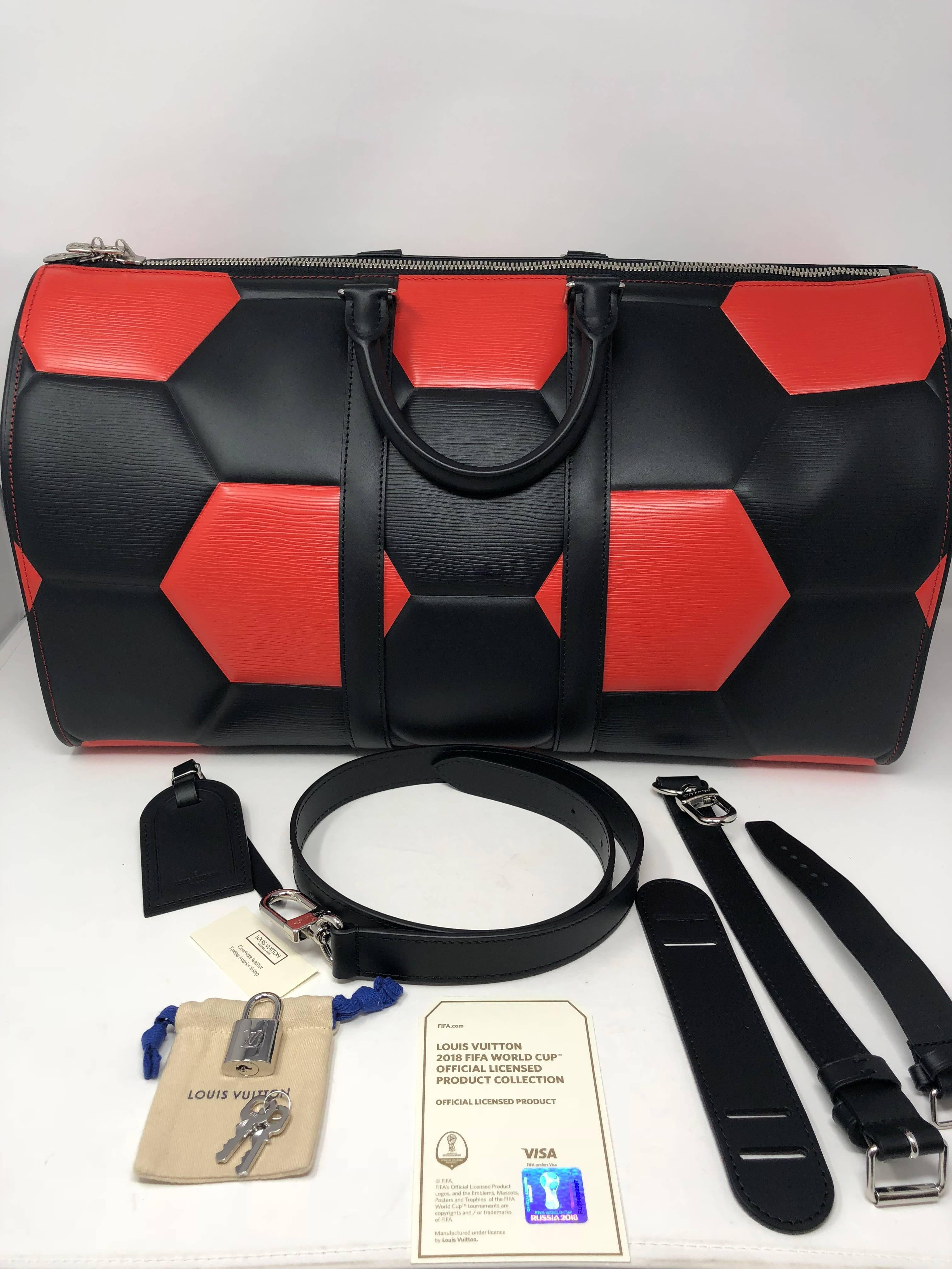 Louis Vuitton Keepall Bandouliere 50 Special Order FIFA World Cup Collection. Custom order of red and black combination. May be the only one in the world. Special collaboration with FIFA and LV to create this soccer ball effect in a bag. This was an
