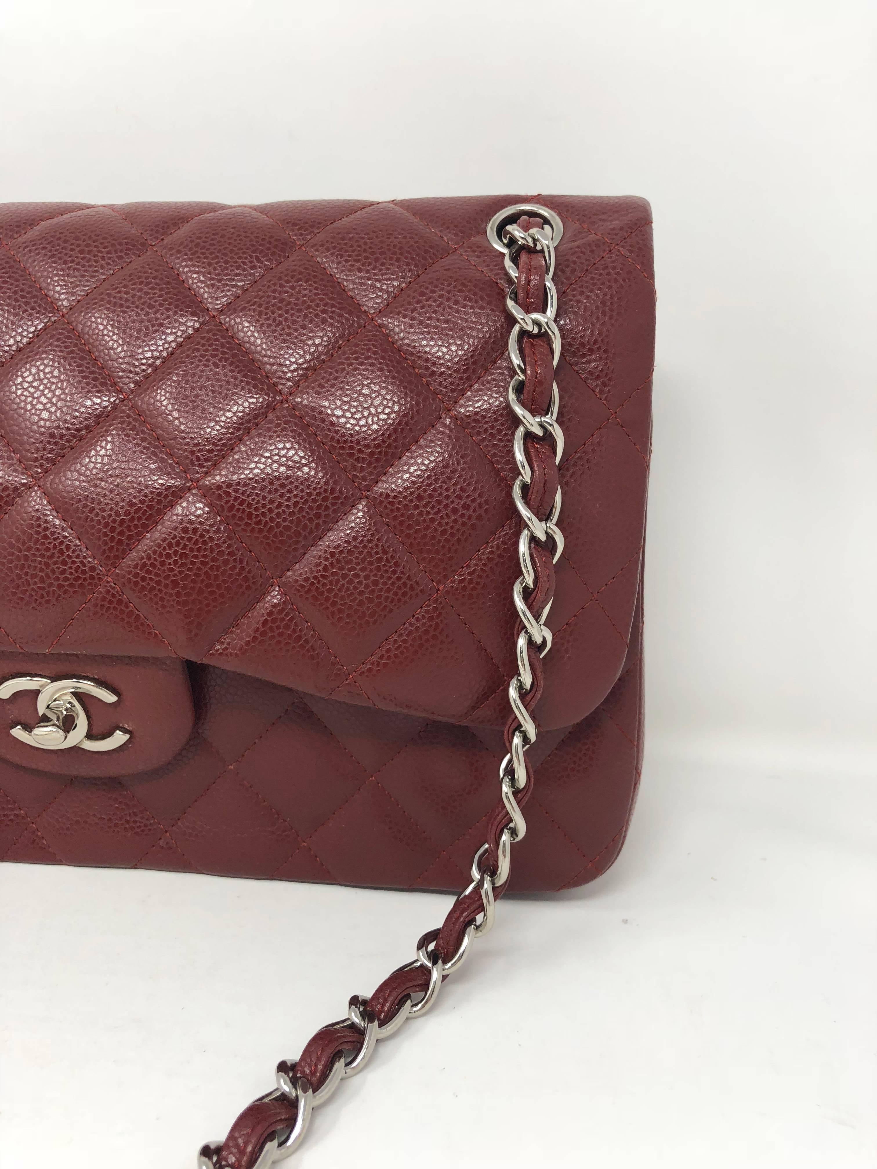 Burgundy Chanel Caviar Jumbo Double Flap Bag with silver hardware. Hard to find color Jumbo bag in good condition. Light wear and chain is shiny and looks hardly worn. Can be worn with strap doubled or a longer crossbody. 