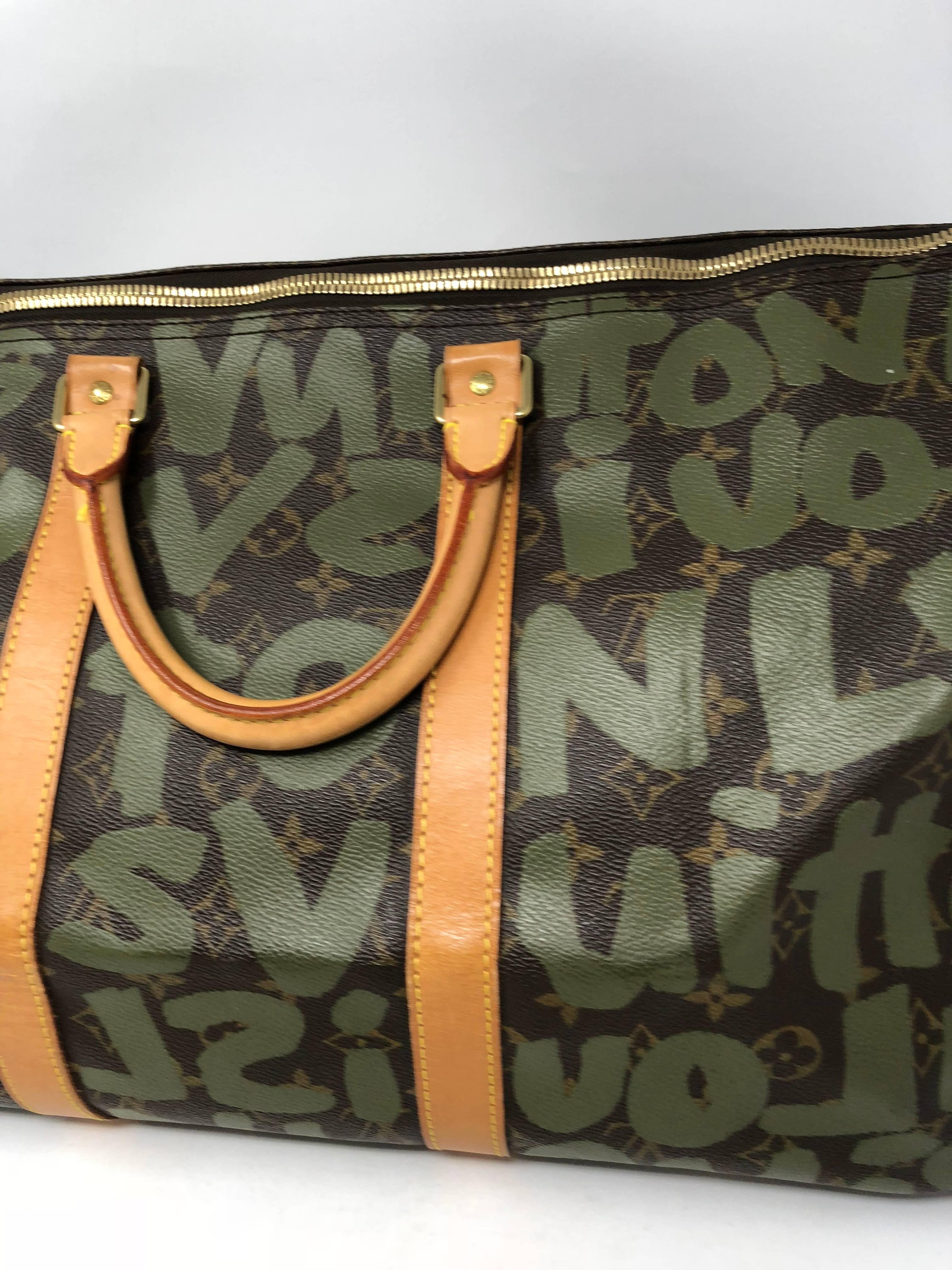 Louis Vuitton Limited Edition Khaki Graffiti keepall 50 by Stephen Sprouse. Highly collected and adored Stephen Sprouse was the artist behind these pieces for LV. Great carry on size. Good condition with golden patina on the leather and handles.