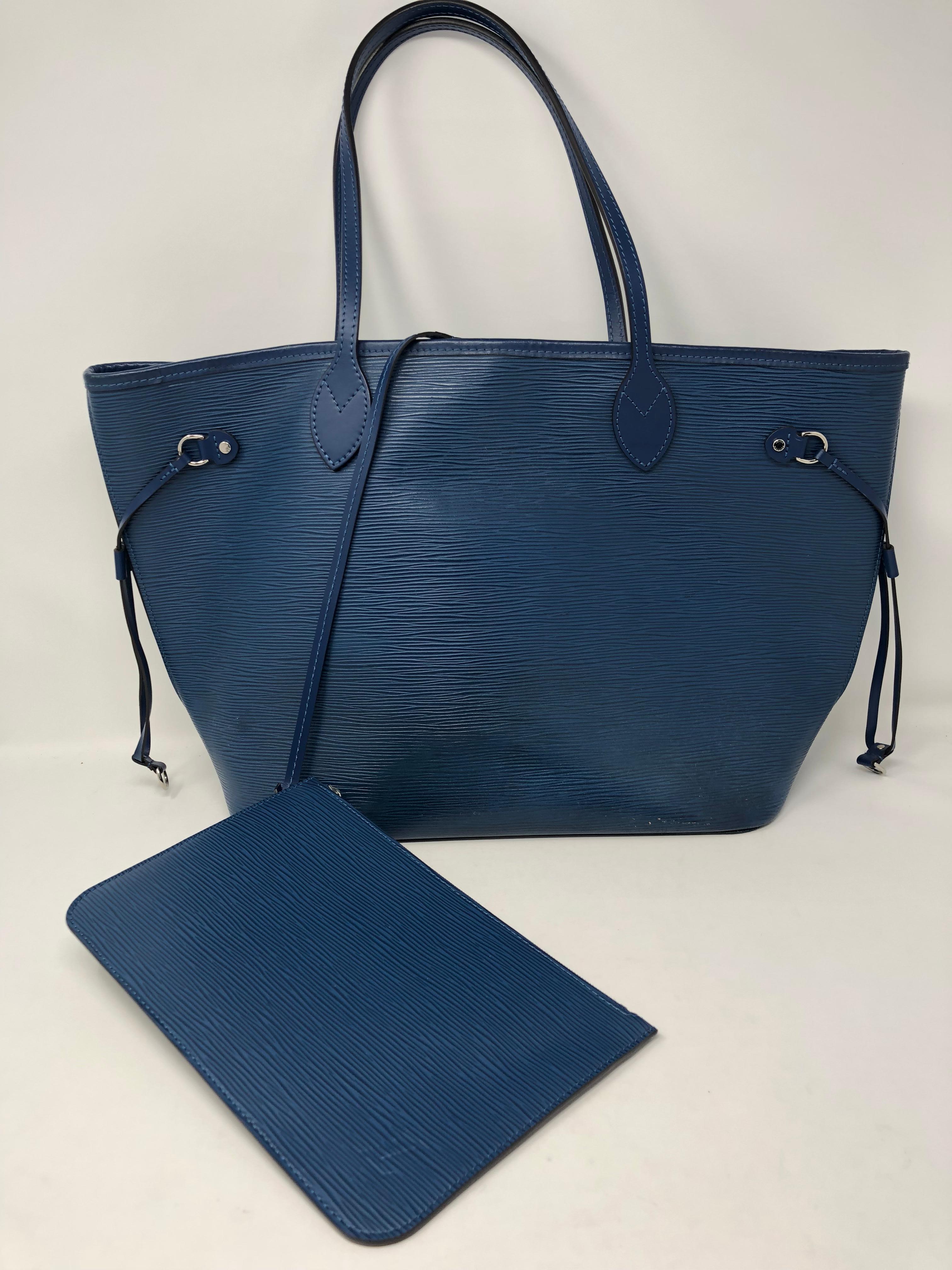 Louis Vuitton Blue Epi Neverfull MM with pouch. Vintage and used condition. Still has a lot of life left. Discontinued color by LV on this style bag. Makes an excellent every day tote. 