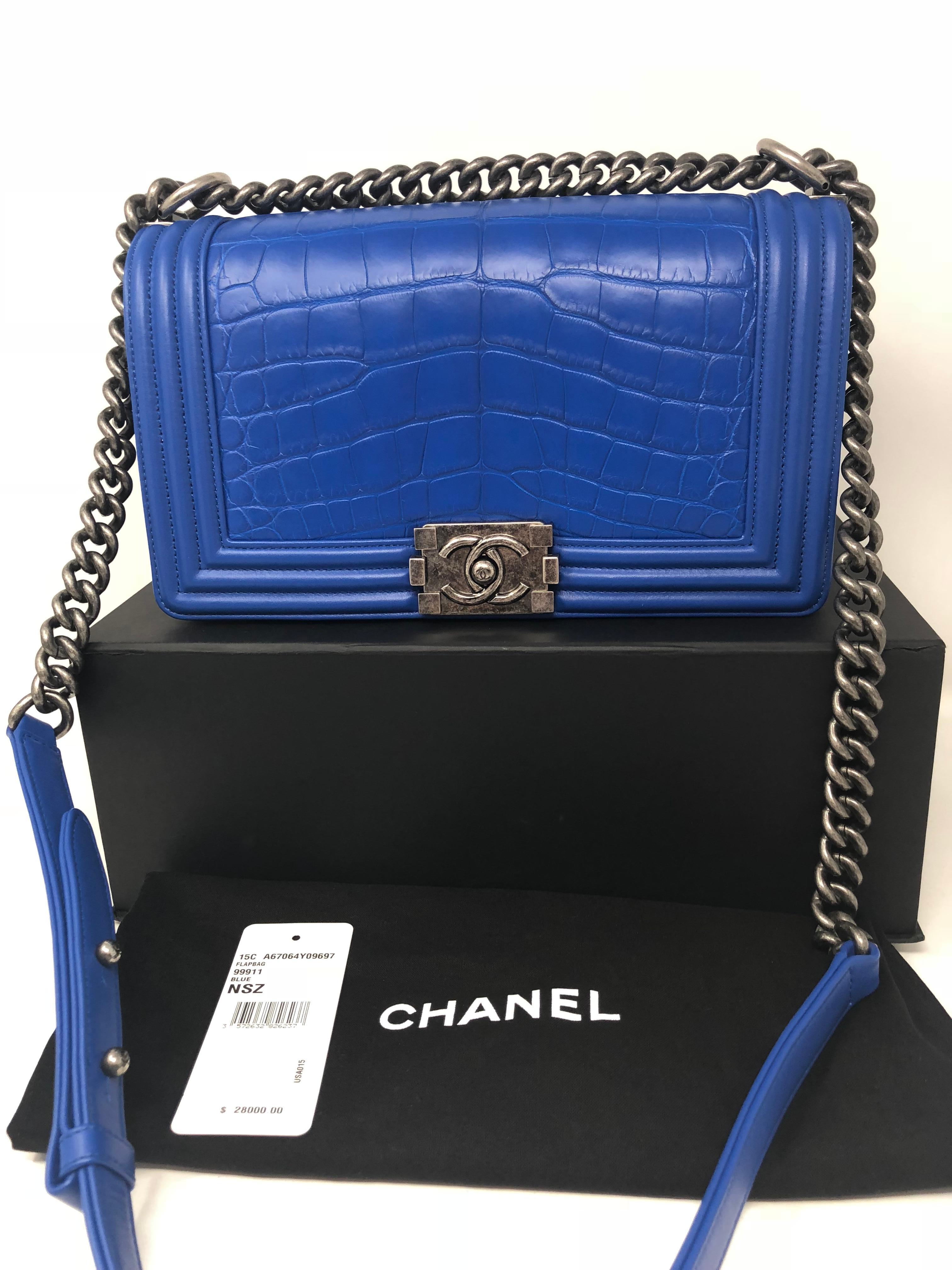 Chanel Alligator Boy Bag in electric blue color. Medium size Boy Bag is brand new condition. It was never used.  From 2015-2016 . Only a handful of these exotic skin bags out there. The original tag, dust cover, box and authenticity card is