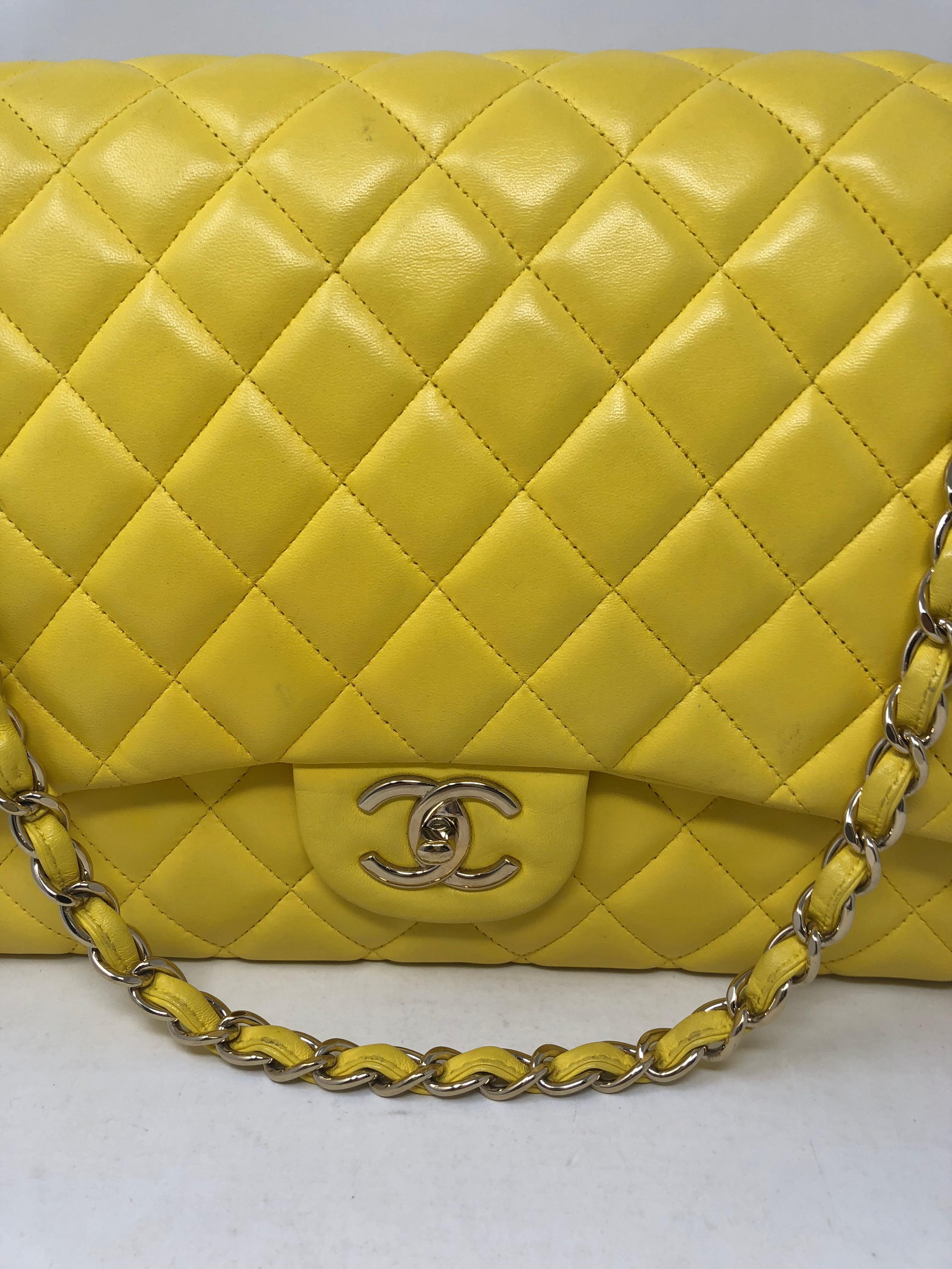 Canary yellow Chanel Double Flap Bag in lambskin leather. Maxi size over 13