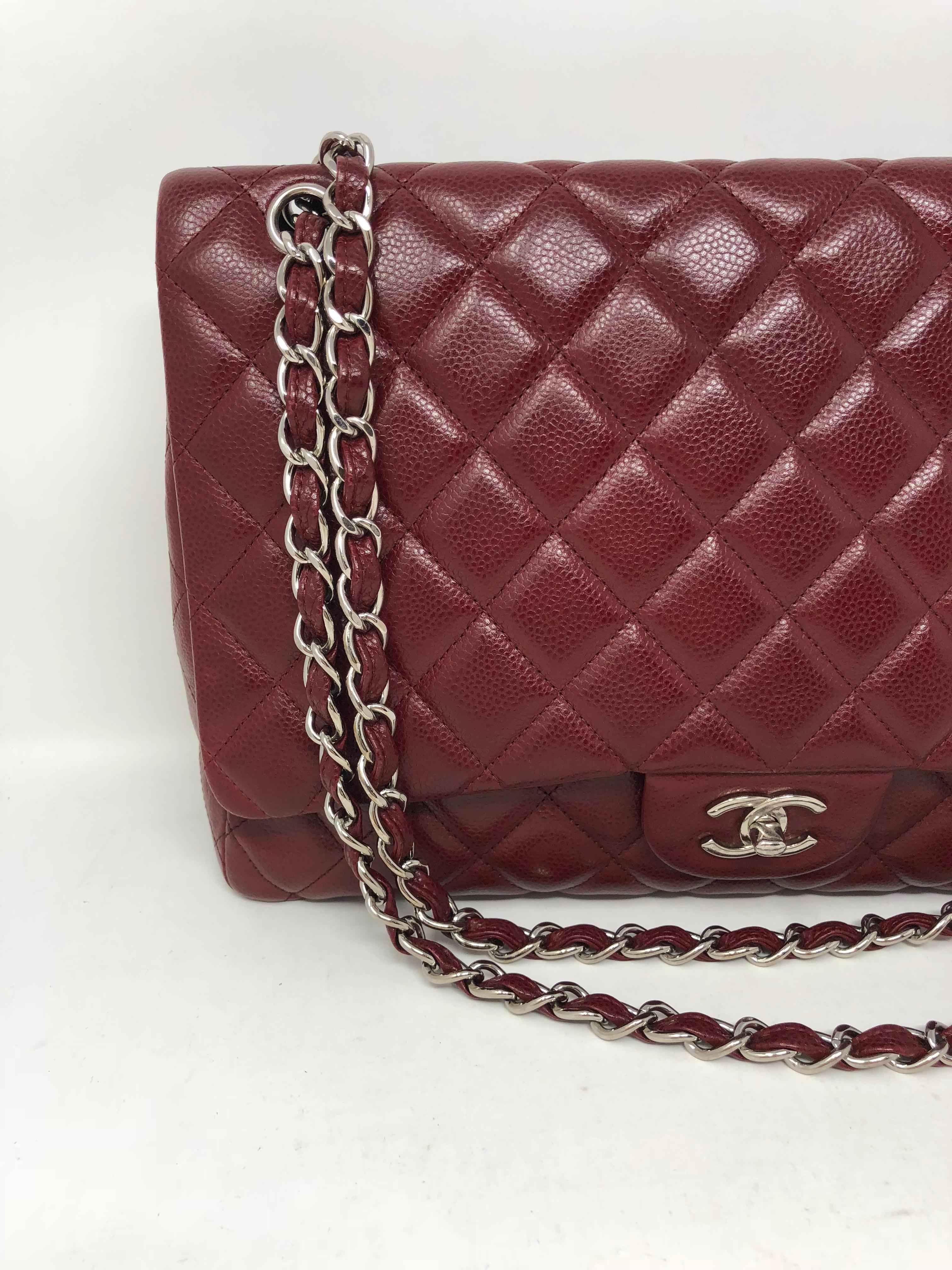 Chanel Burgundy Maxi Single Flap in Caviar Leather. Silver hardware can be worn crossbody or as a double strap bag. Good condition and deep burgundy color. Caviar leather is durable. Guaranteed authentic. Comes with authenticity card. 