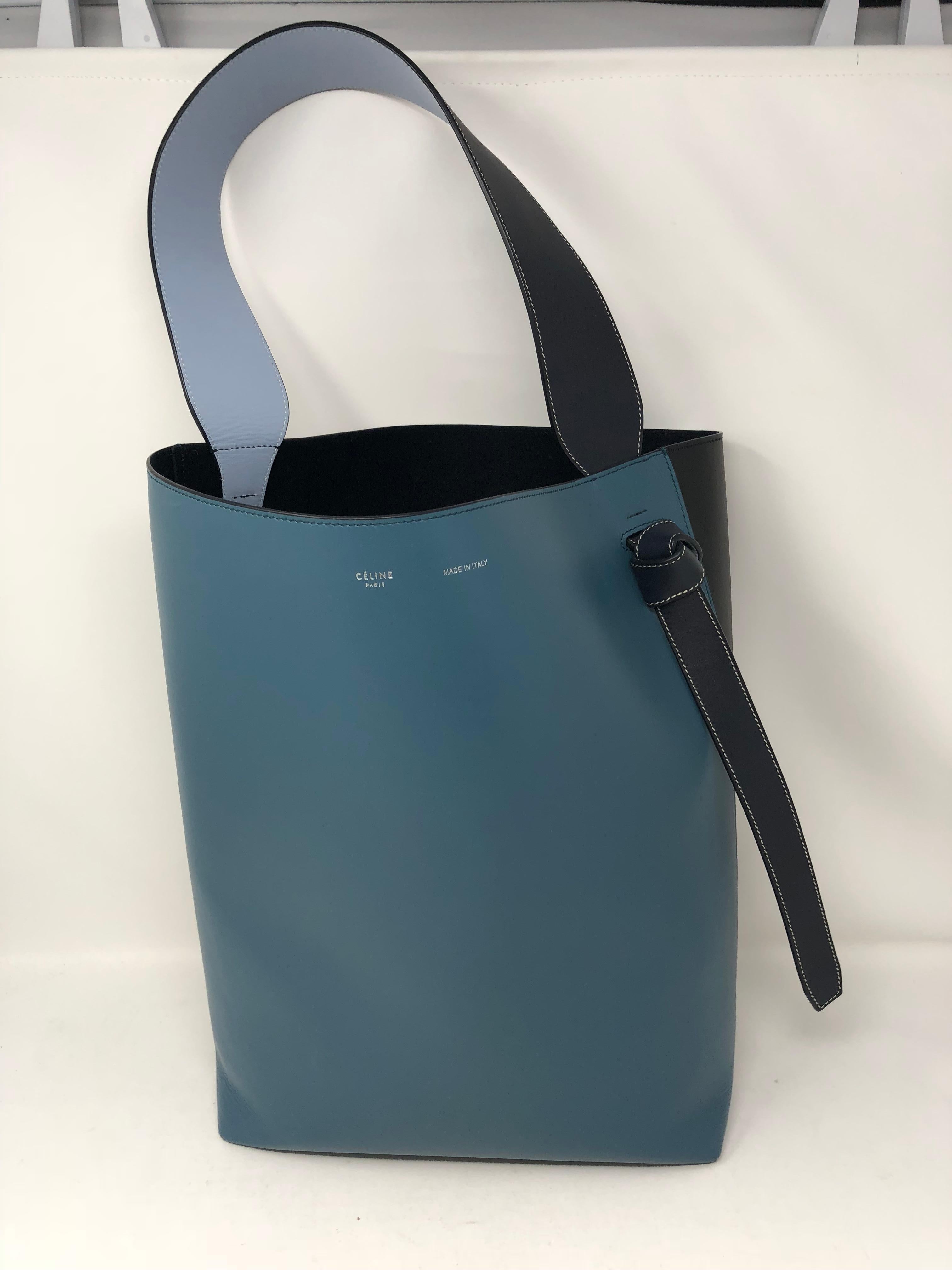 Celine Blue Bucket Style Bag with trio colors. Blue, black and light blue. New condition. Comes with interior clutch/pouch. Smooth leather bag. Guaranteed authentic. 