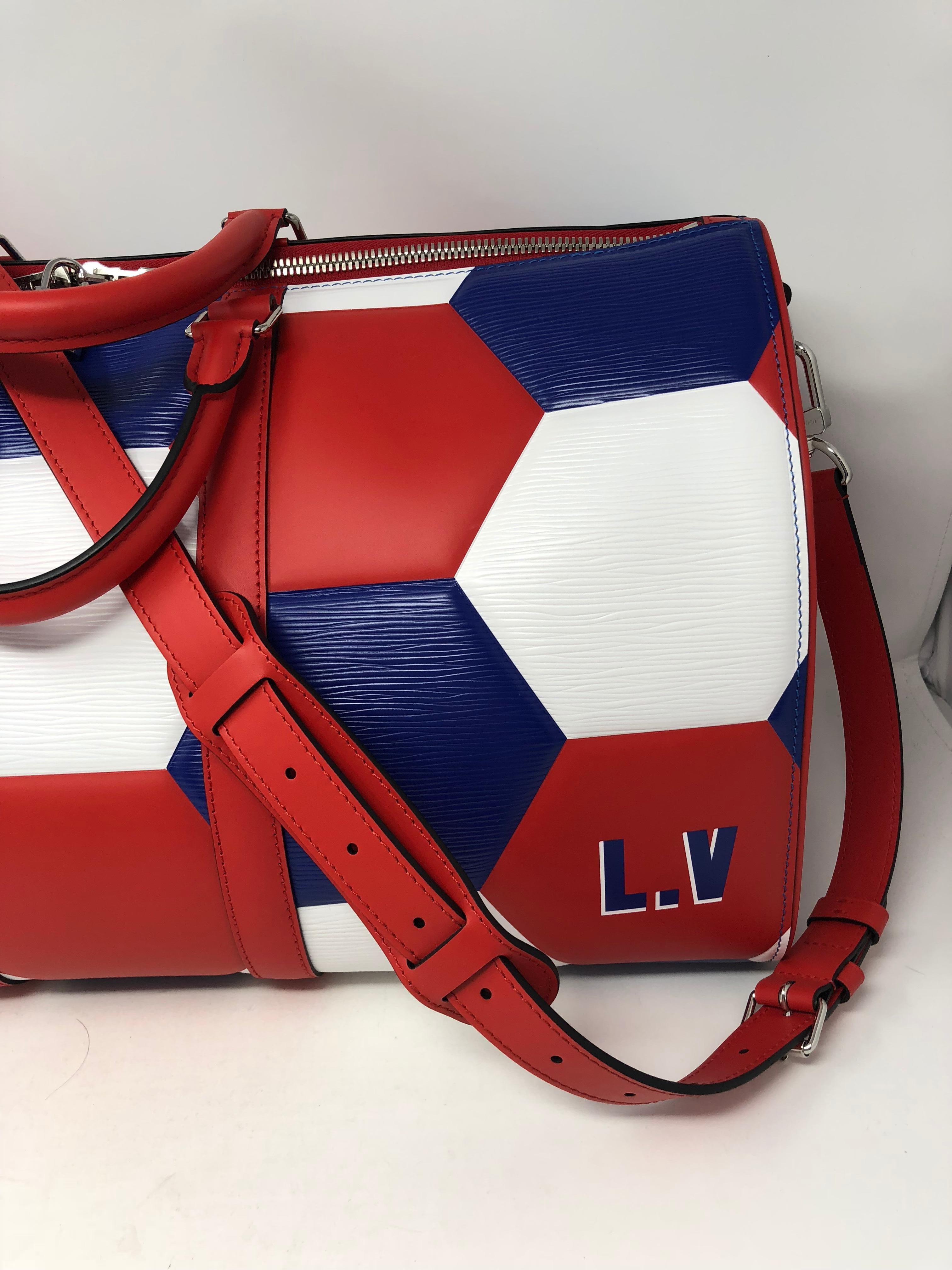 Louis Vuitton 2018 FIFA for World Cup Soccer Special Order Keepall 50 with strap. One of a kind since it was specially made for a client. Red, white and blue colors chosen to create this luggage piece. Never got to be used and taken out. Comes with