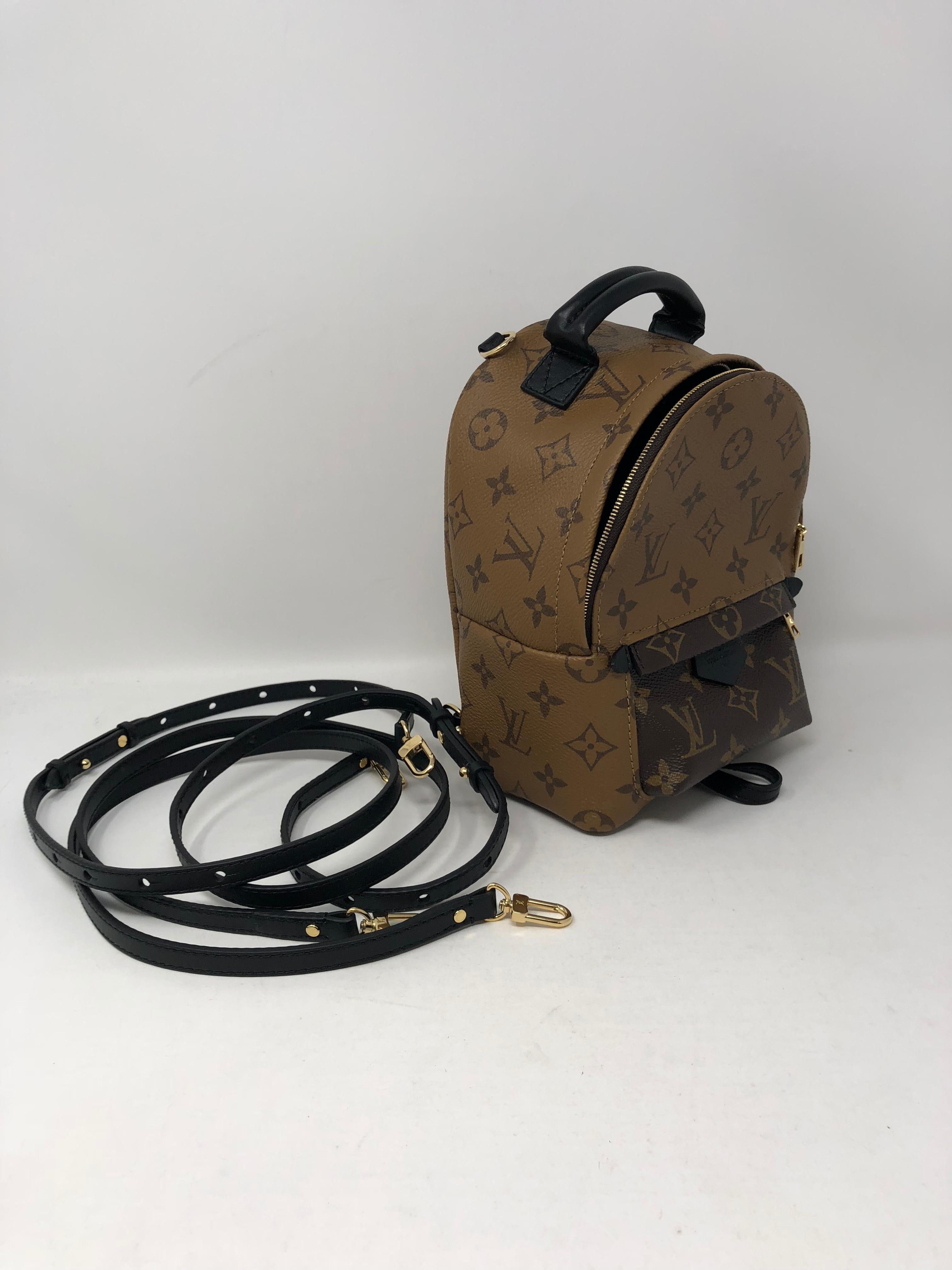 Louis Vuitton Palm Springs Reverse Mini Black Brown Canvas Backpack. Cute mini size backpack that can be worn crossbody, as a fanny pack, or as a backpack. Rare and limited. Brand new condition, never worn. Comes with the complete set. Guaranteed