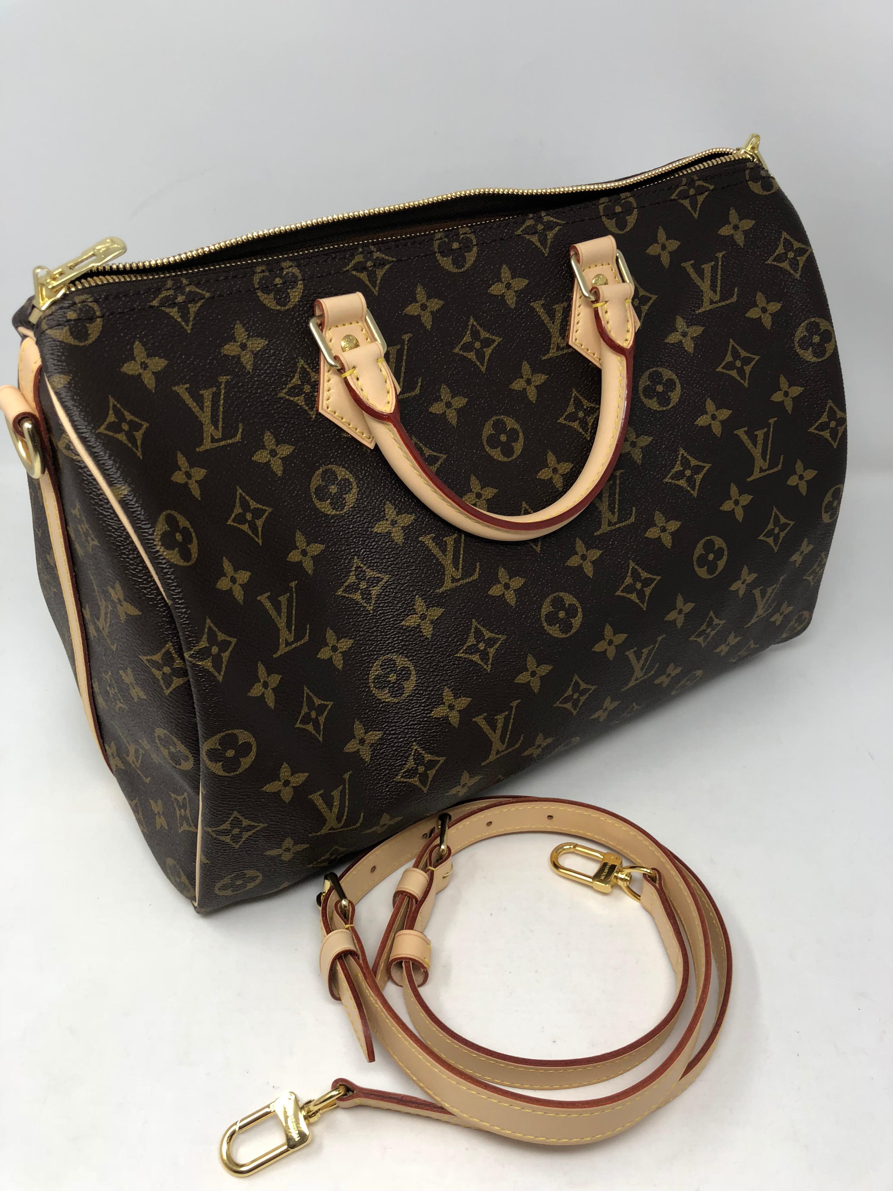Louis Vuitton Speedy 35 Bandouliere Monogram with removable strap. This iconic bag in monogram is limited and sold out. Brand new with dust cover, lock and keys, and box. A staple for your collection. 