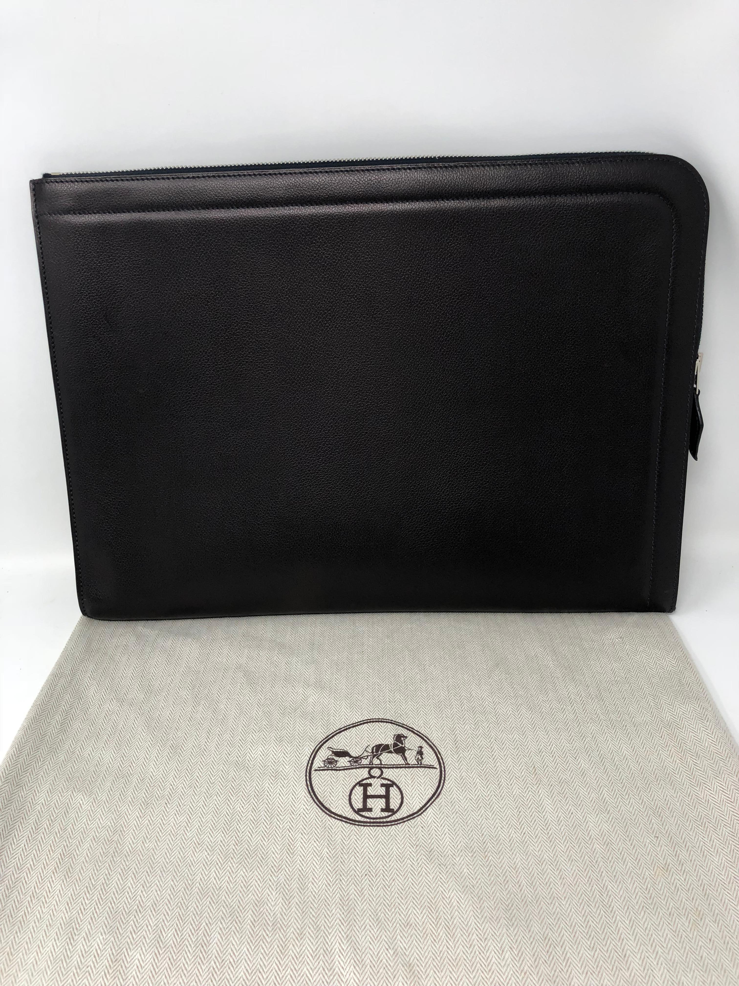 Hermes Zip Computer Laptop Sleeve Case in Bleu Indigo color. Veal Ver Grain leather. Brand new condition. Never worn. Still has the original sticker price inside the bag from Hermes. Stunning dark navy/almost black color with silver hardware. Comes