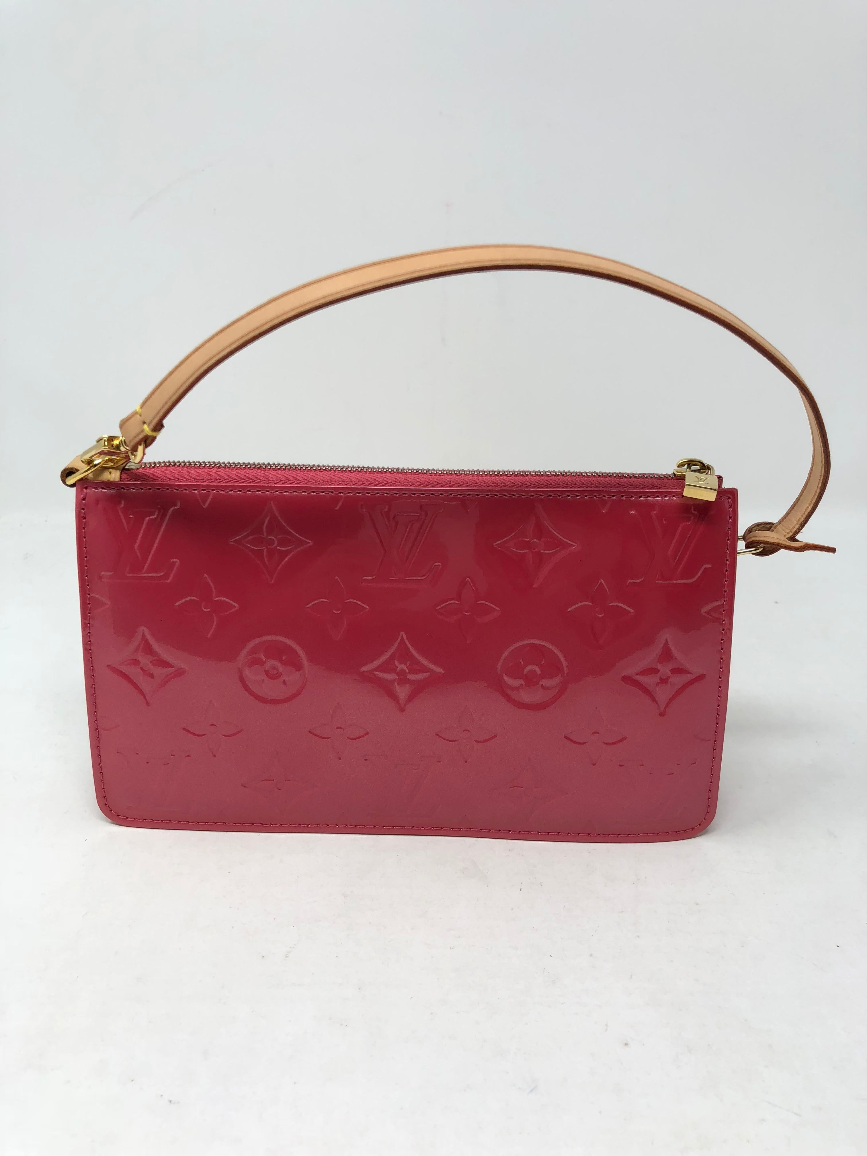 Louis Vuitton Lexington Pochette Monogram Vernis Pink Leather wristlet. Like new condition. Can be worn as a clutch or small handbag. Guaranteed authentic. 
