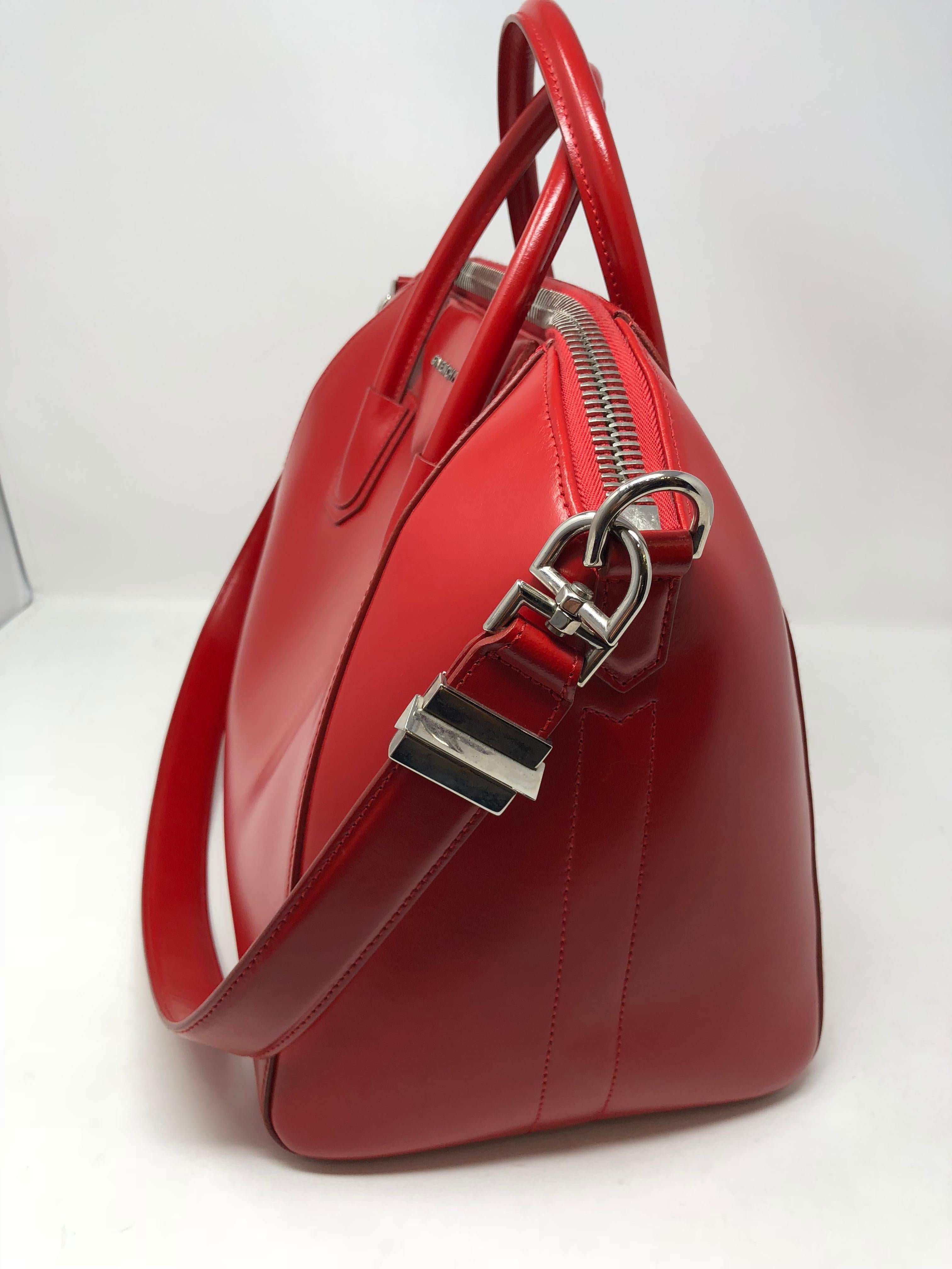 Givenchy Red Antigona Bag Medium in box calf leather. Beautiful bright red color sold out. Hard to find in this apple red color. Mint condittion. Guaranteed authentic. 