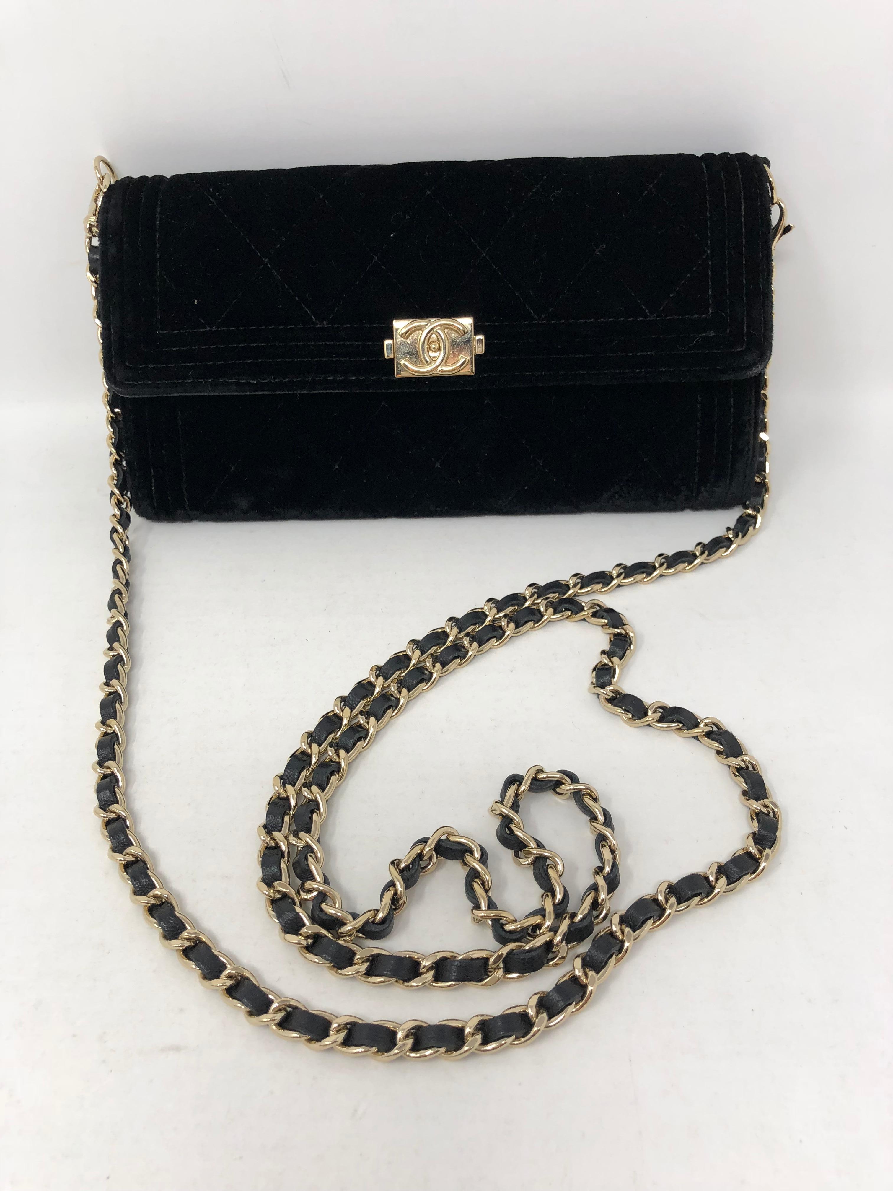 Chanel Black Velvet Crossbody/ Clutch with gold hardware. Excellent condition. Strap is removable. Perfect evening bag or use even as a wallet. Similar to a Wallet on a chain. Velvet exterior. Own this beauty. Guaranteed authentic. 