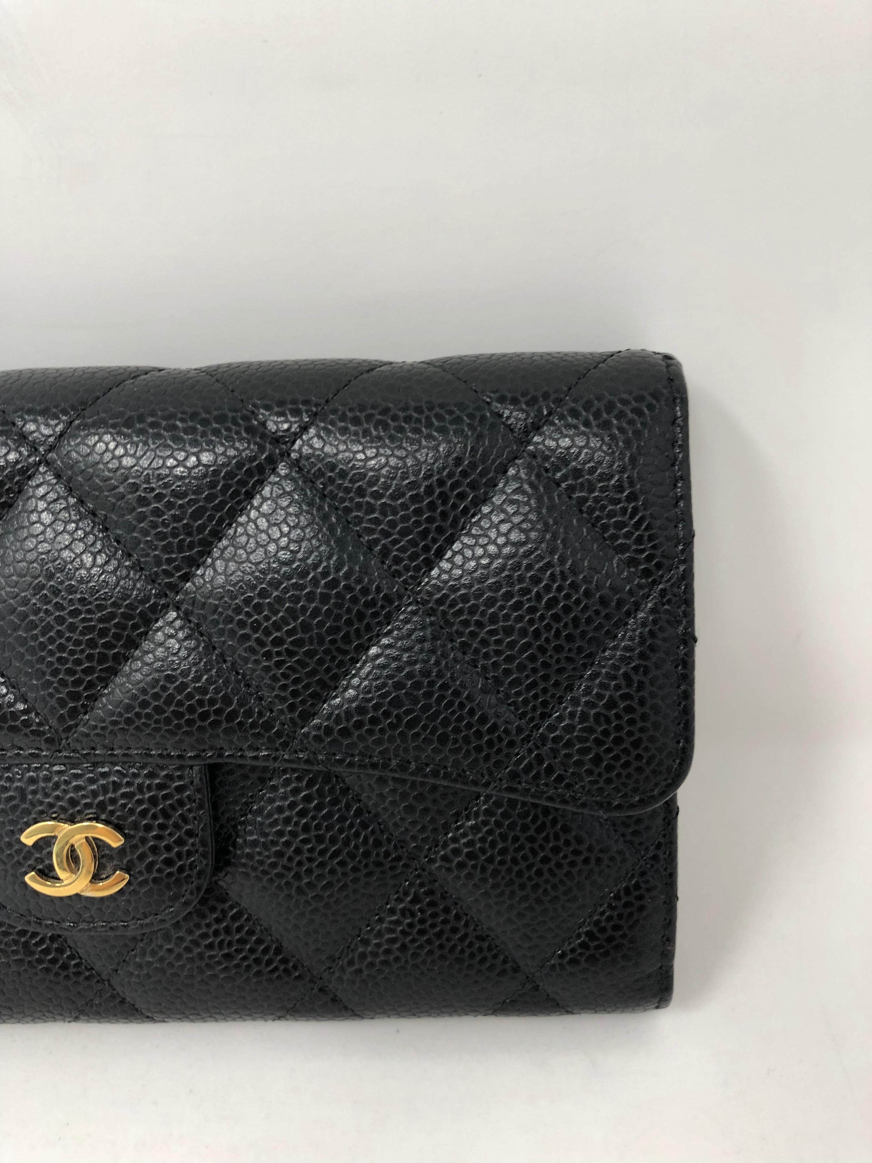 Chanel Black Wallet in Caviar leather. Good condition. Hard to find size. Includes authenticity card. Guaranteed authentic.