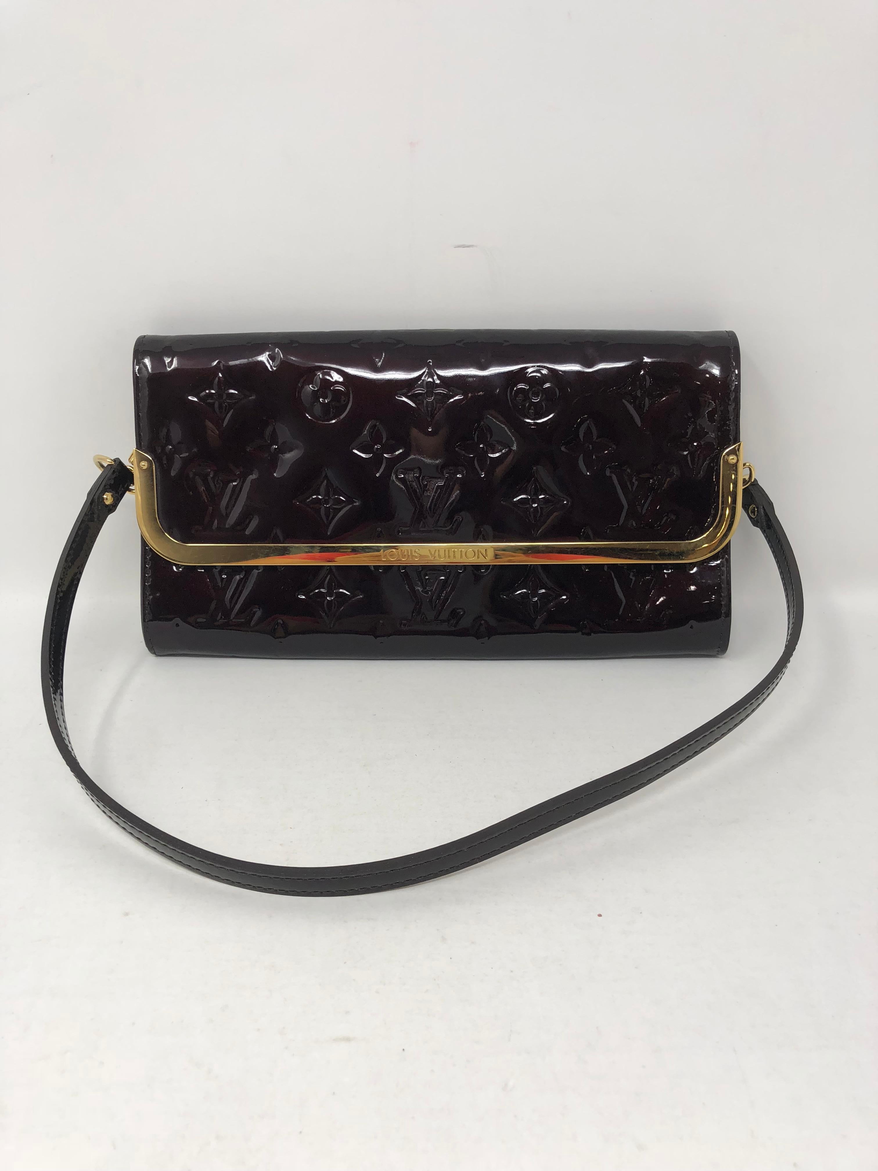 Louis Vuitton Vernis Clutch and shoulder bag. Dark burgundy color with gold hardware. Can be worn as a wallet too with credit card slots inside. Beautiful sheen in good condition. 